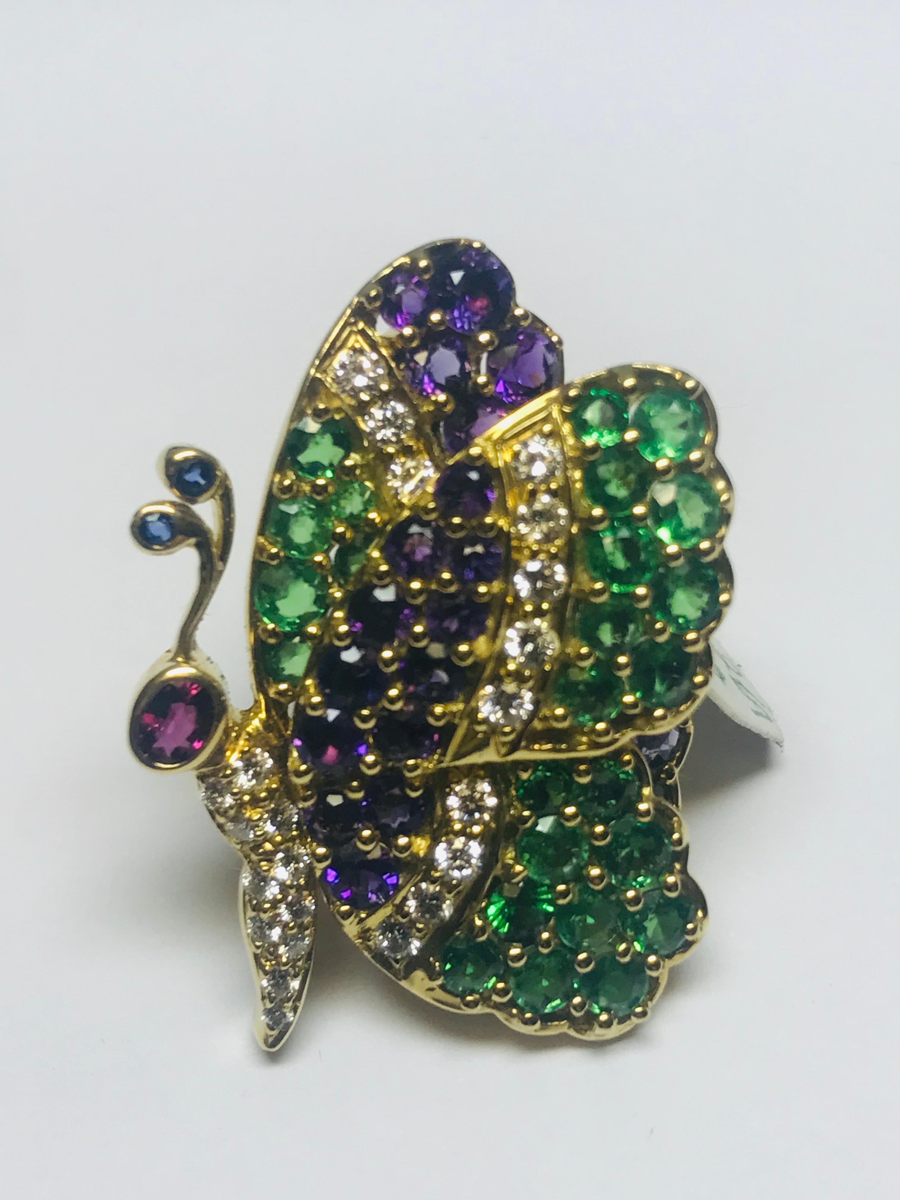 This uniquely designed profile butterfly brooch, designed and created by Jean Vitau, has such an amazing color combination. Combining 2.69 carats of Amethyst with 3.15 carats of Tsavorite is just beautiful!! Add to it .55 carats of diamond and a