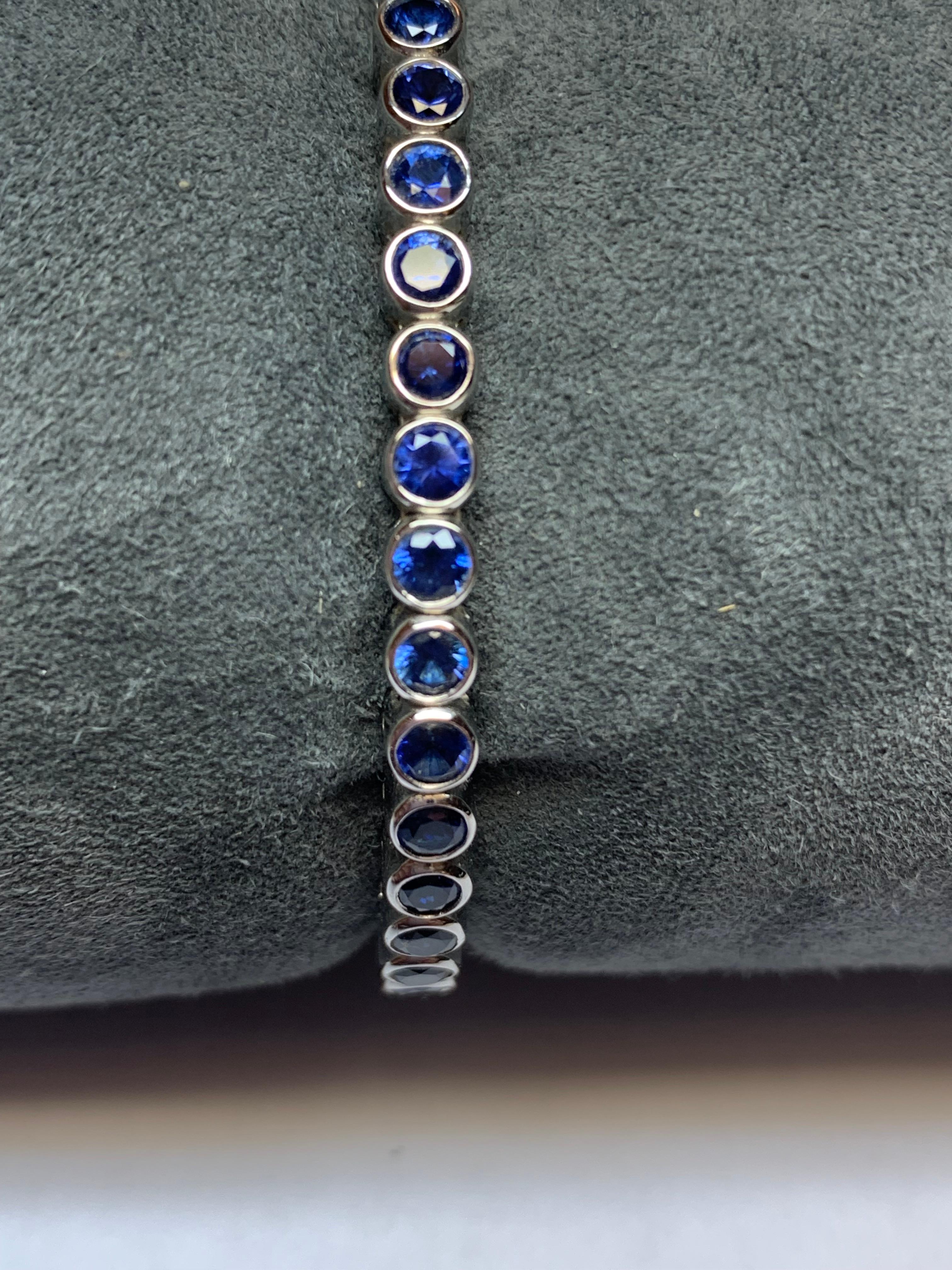 Modern Jean Vitau 18 Karat White Gold Blue Sapphire Spring Bangle Bracelet For Sale