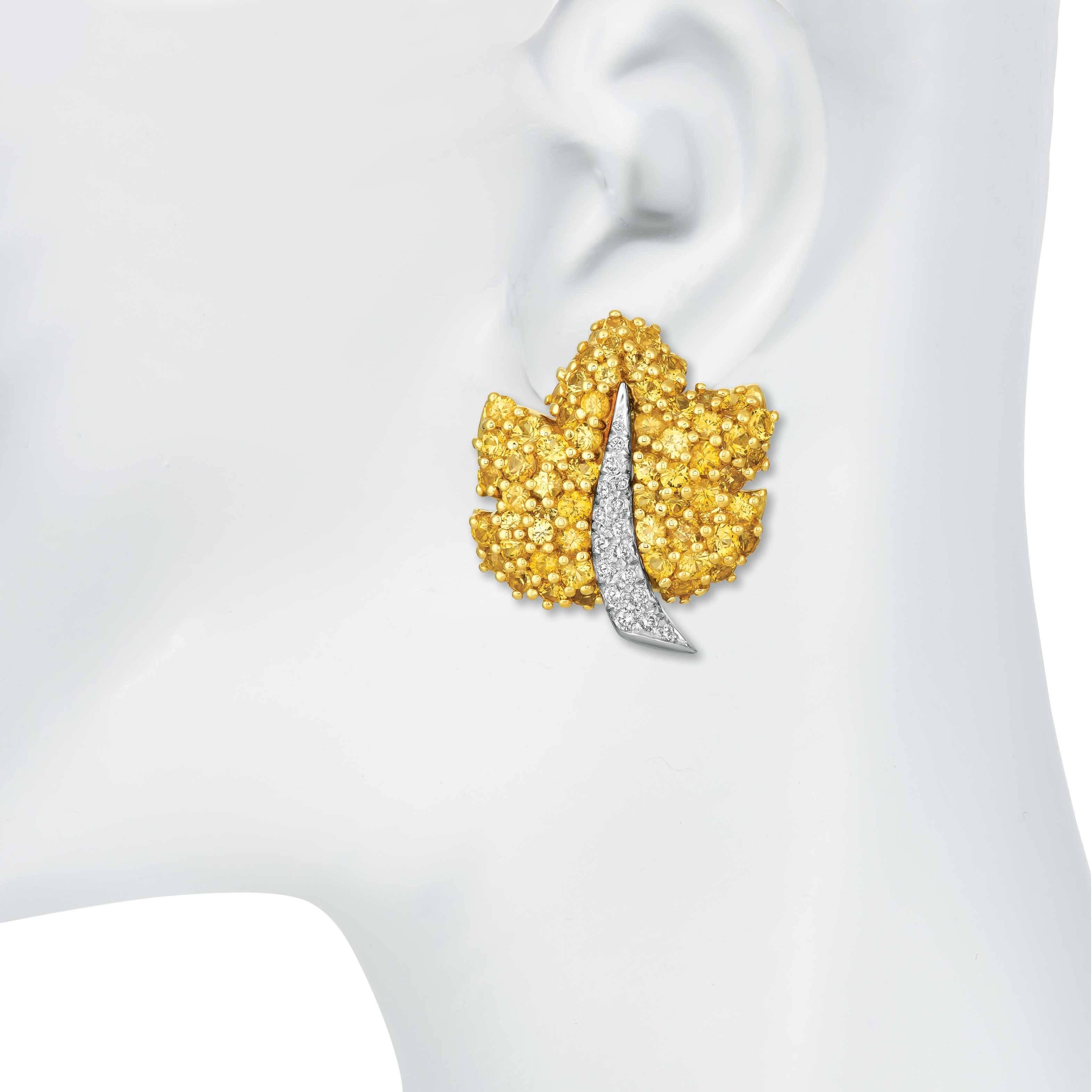 18 karat gold leaves are set in Royal pave with 8.75 carats bright Yellow Sapphires inspiring autumn. The center of the leaves are Platinum set with .50 carats of diamonds total weight.