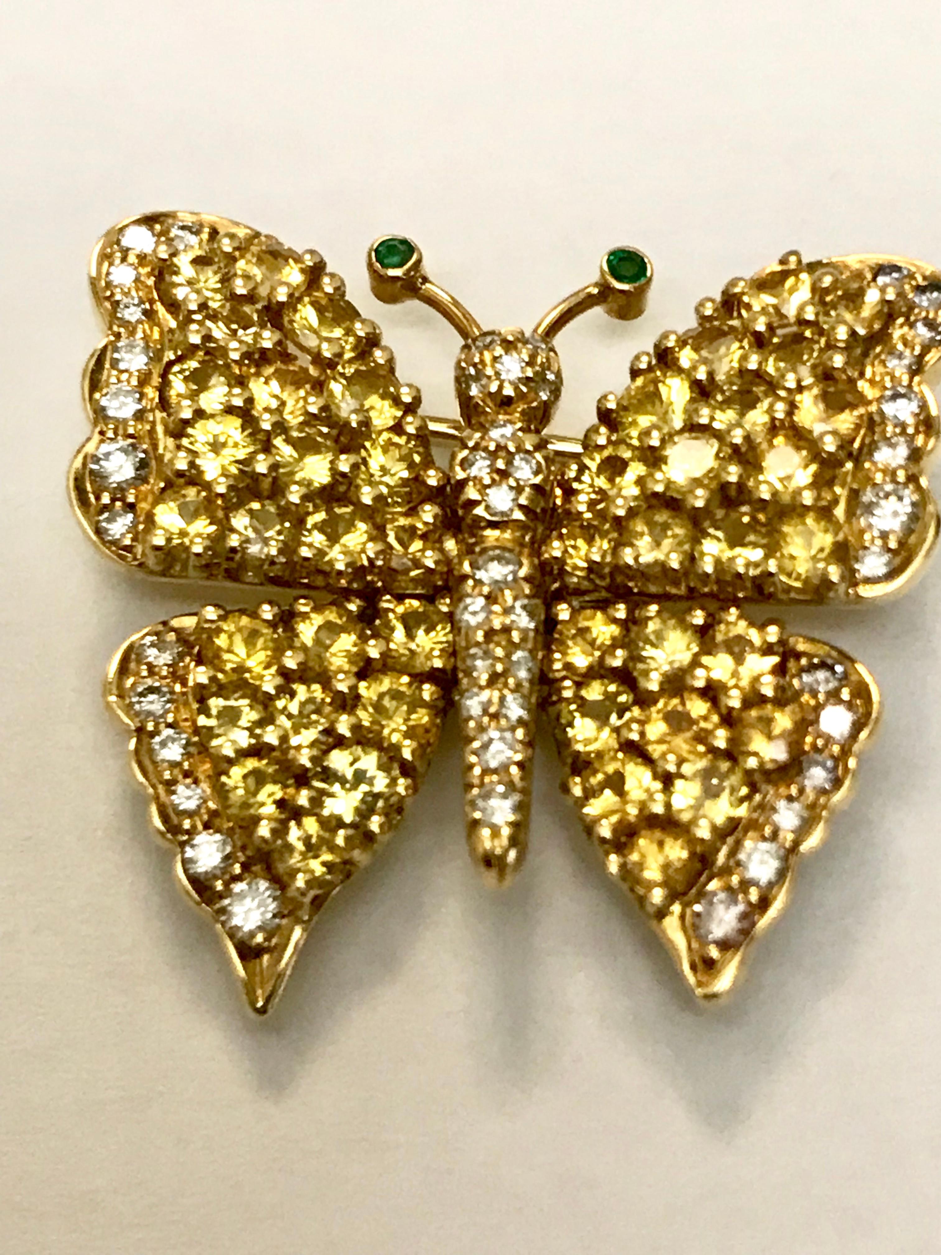 The vibrant Yellow Sapphires reminds you of Spring! Contrasted with the F/G color white diamonds makes it a perfect everyday piece, and don't forget the Emerald antennae!! There are 3.80 carats of Yellow Sapphires and .50 carats of diamonds. This