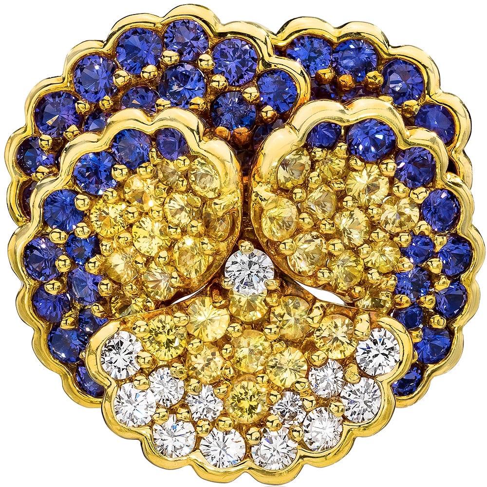 Designed by the famed French designer Jean Vitau for Gemveto. Jean Vitau was a pioneer jewelry designer . He was known for patenting the Gemlok setting ,a secure and snag proof way of setting diamonds and colored stones.

This lovely pansy brooch is