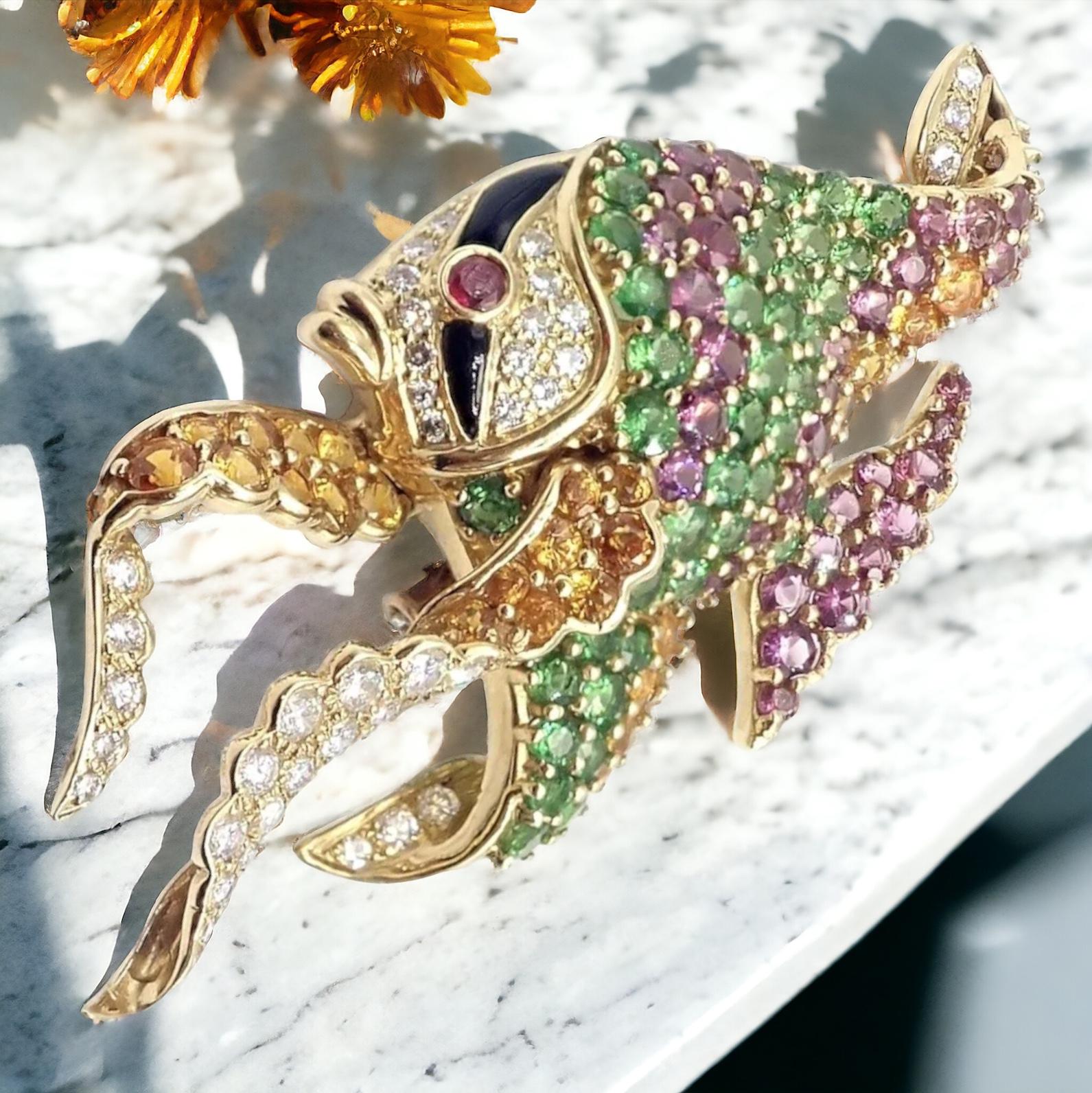 The authentic rare Jean Vitau 18k yellow gold diamond tsavorite yellow sapphire ruby Angel Fish Brooch is a stunning example of the designer's exquisite craftsmanship. The Angel Fish design is intricately detailed with fine lines and curves, while