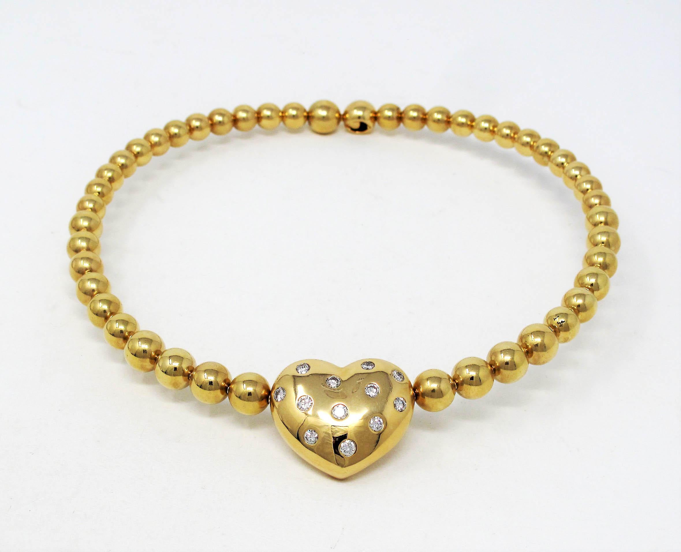 Romantic gold and diamond heart choker necklace absolutely radiates on the neck. This stunning Jean Vitau design gives an elegant, ultra-feminine feel with its glimmering diamonds and flattering tapered shape. This necklace is sure to