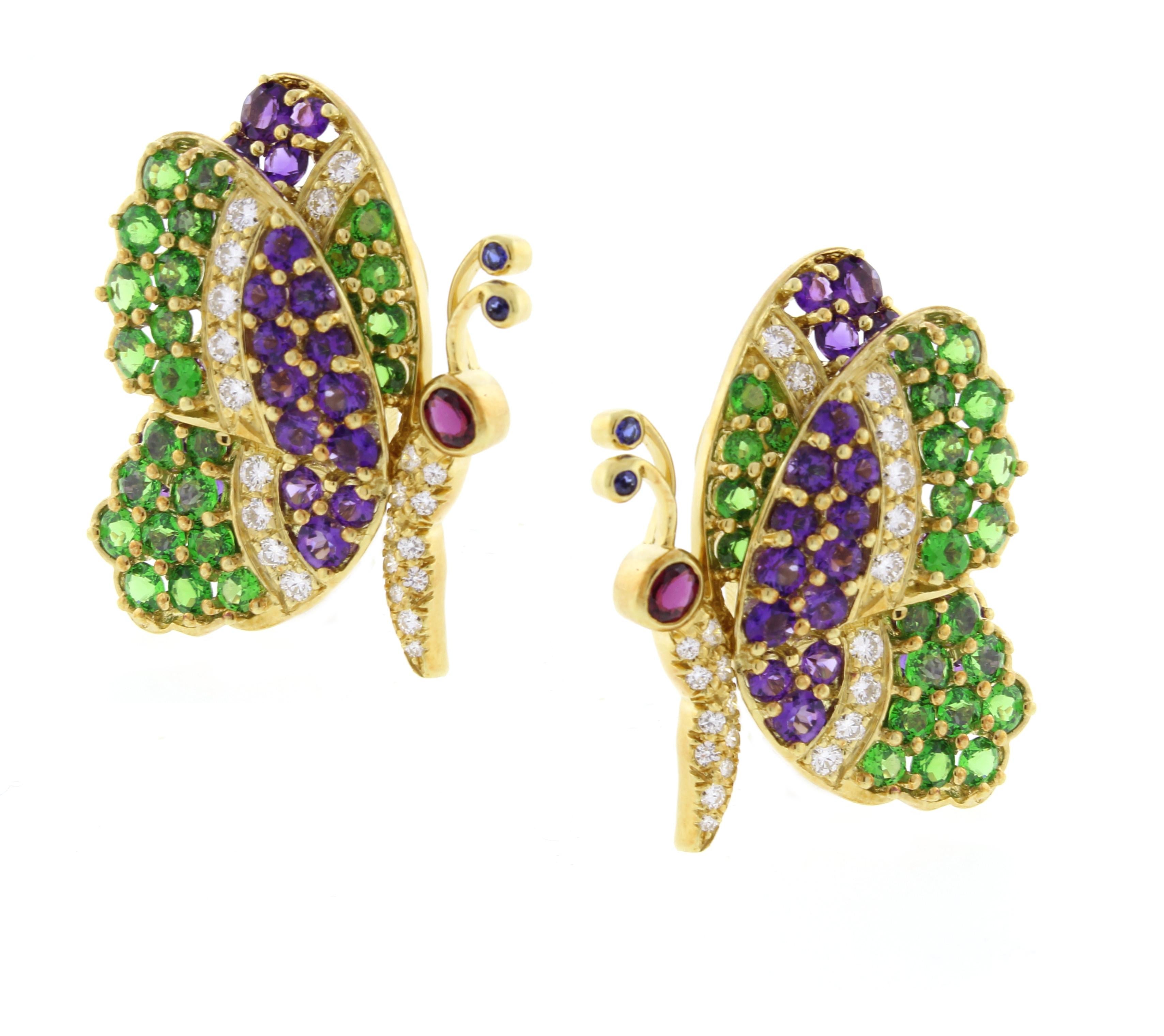 From French designer Jean Vitau;  a pair of tsavorite, amethyst and diamonds earrings
♦ Designer / Jean Vitau 
♦ Metal:  18 karat
♦ Gem stone: Diamonds = 1.00 G-VS1
♦ Gem stone: Tsavorite = 7.40
♦ Gem stone: Amethyst =4.4
♦ Gem stone: Ruby =.35
♦