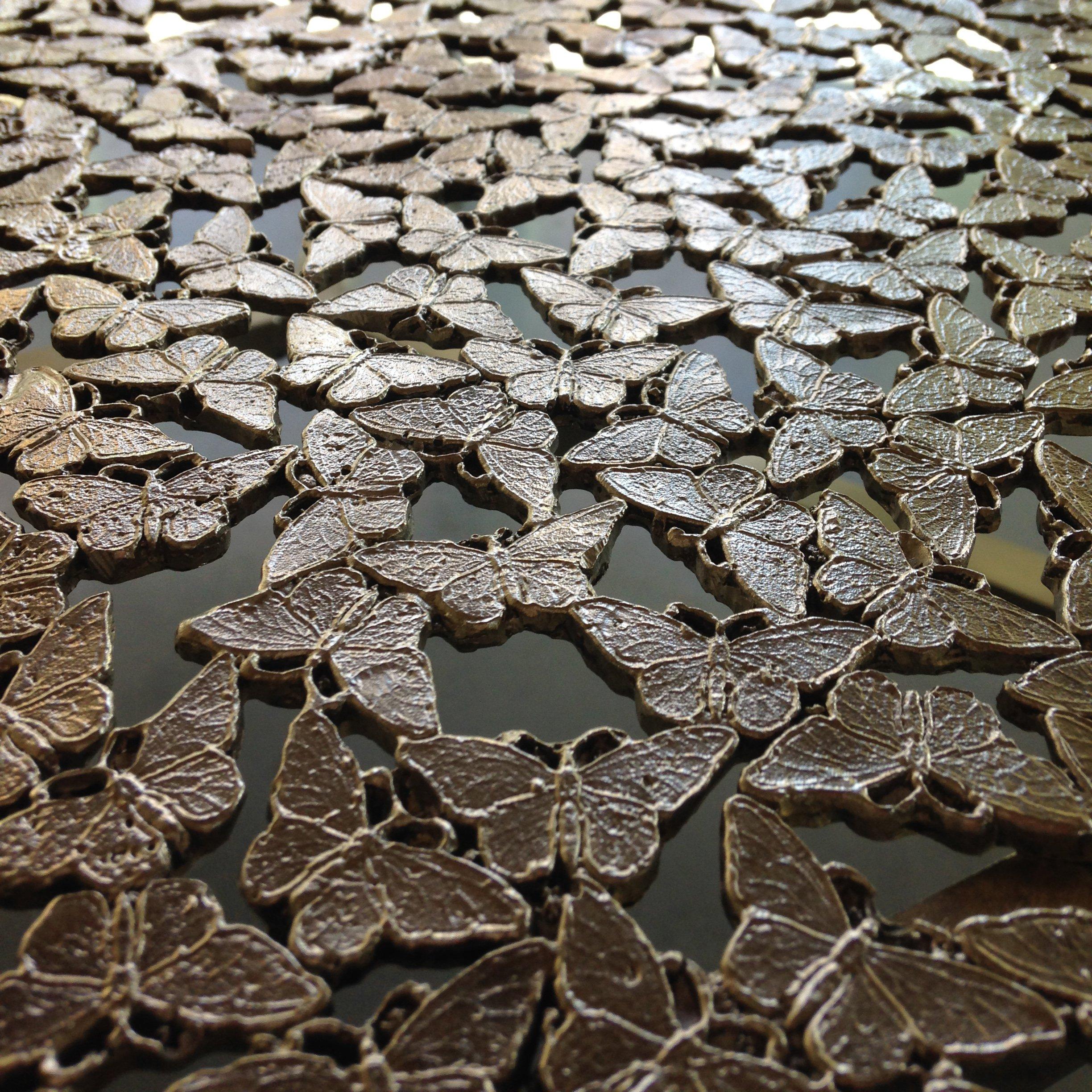 A round swarm of butterflies as delicate as lace in white bronze, lost wax cast by master craftsmen in Italy. A wall sculpture for both indoor and outdoor use.

This listing is for the white bronze version, for the blackened bronze version, please