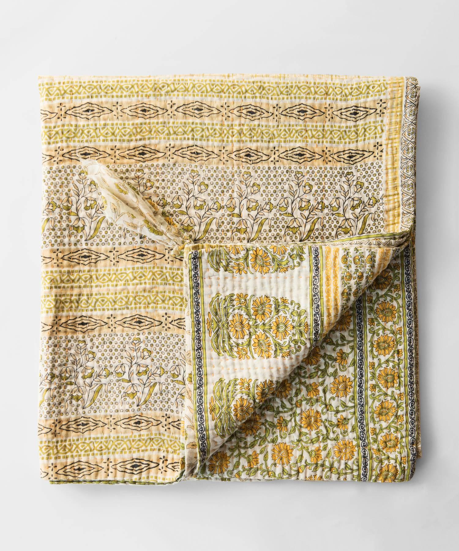 Jeanette Farrier Indian quilt

Kantha quilt made from a patchwork of layers of cotton sari joined by a simple running stitch that produces a rippled effect. Each piece is unique.
