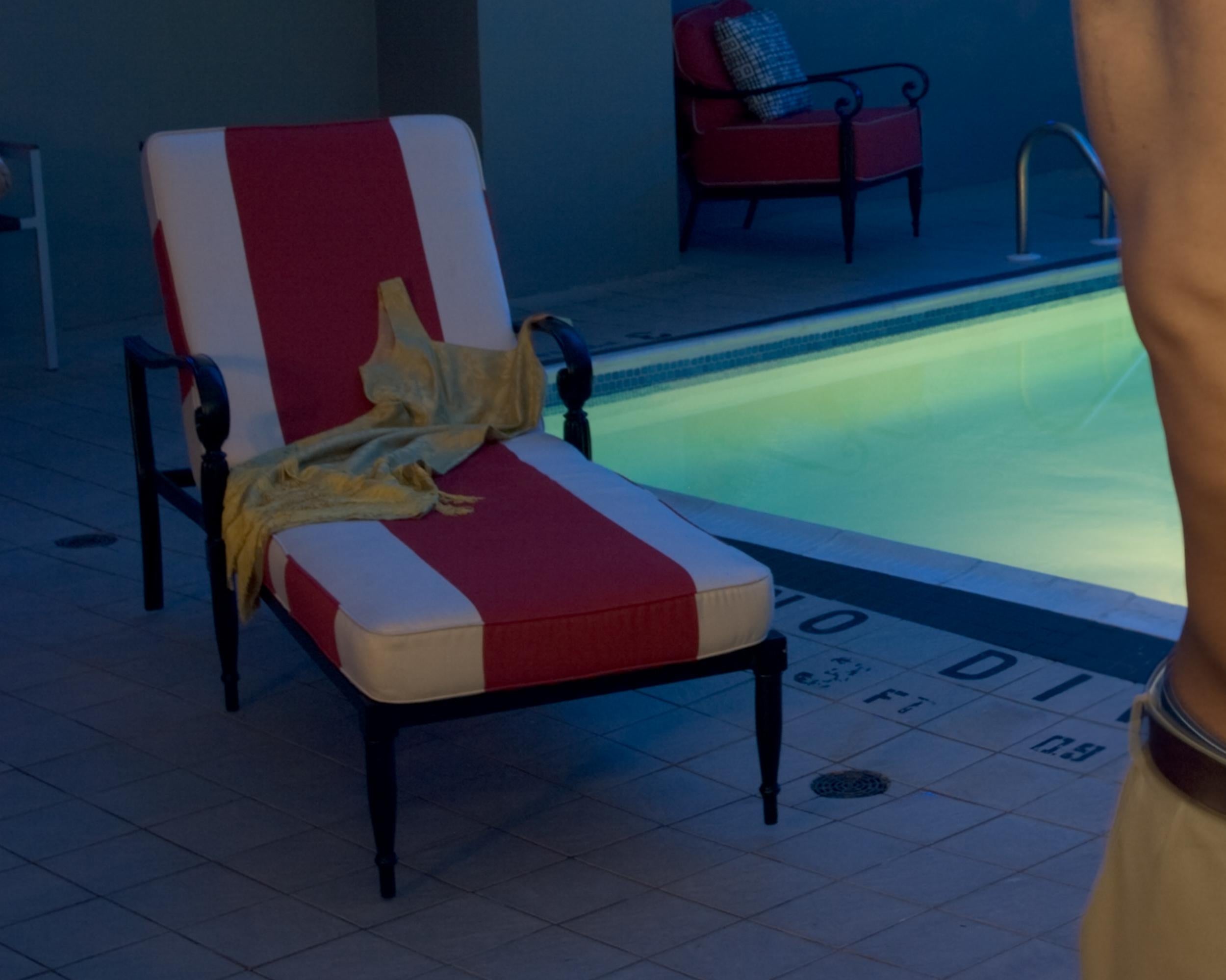 “Easy on the Eyes: Dorothy“ is a staged photograph of an attractive man standing next to a swimming pool. He pulls off his shirt to reveal a muscular torso. In this cinematic photo series, I explore the female gaze by providing visual pleasure