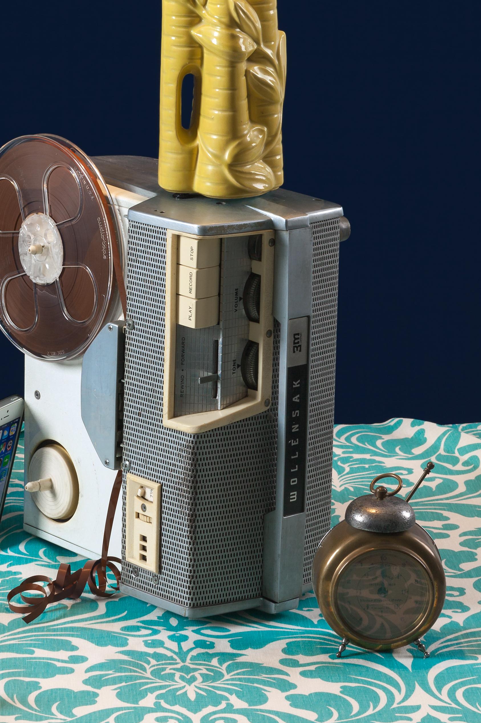 “Reel to Reel,” from my “Tech Vanitas” photography series, embraces our love for beautifully designed, vintage items and anxiety over new technology. My still lifes clearly reference 17th Century Dutch vanitas paintings and their air of craft