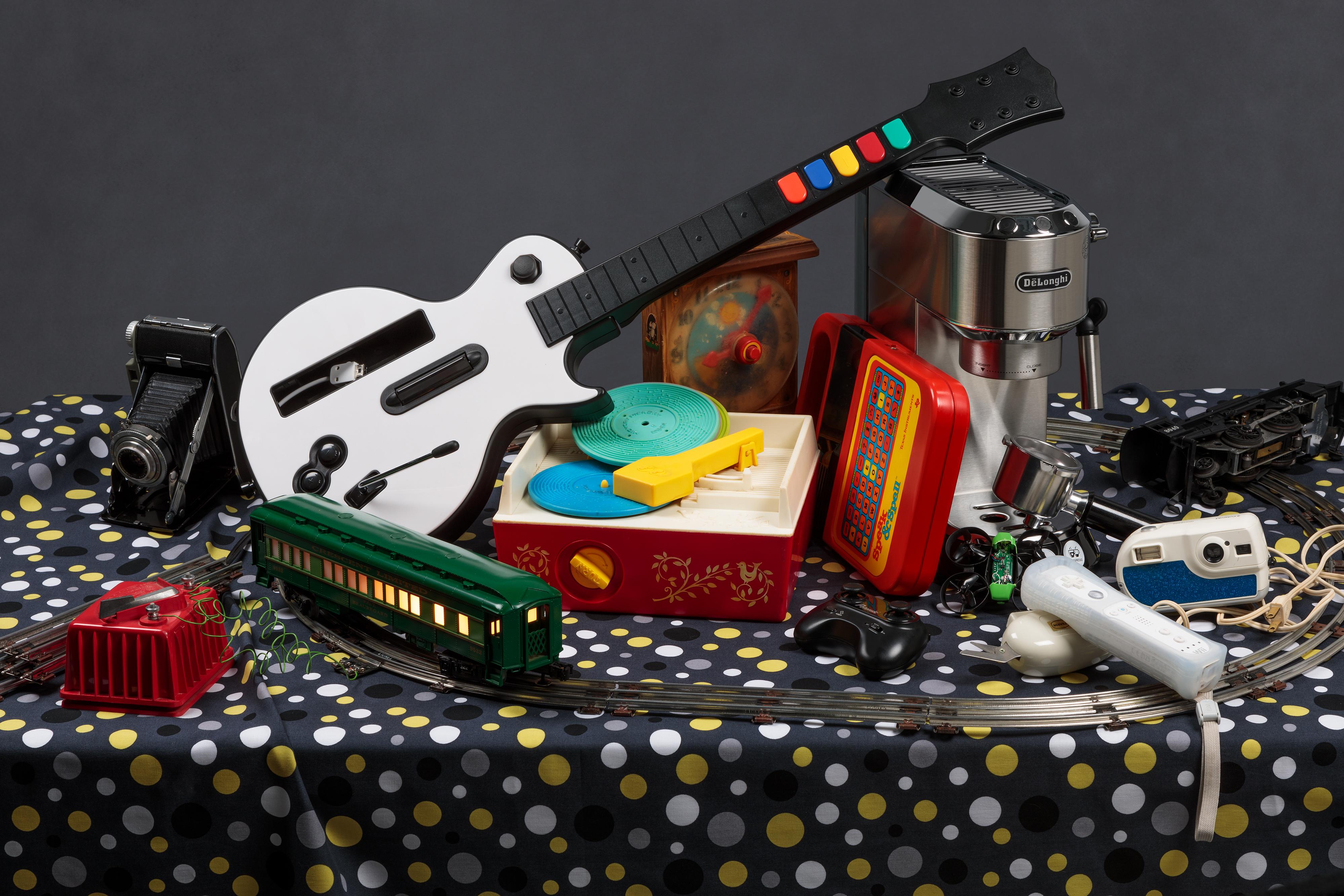 Jeanette May Still-Life Photograph - "Tech Vanitas: Train Set" contemporary still-life photograph of vintage toys