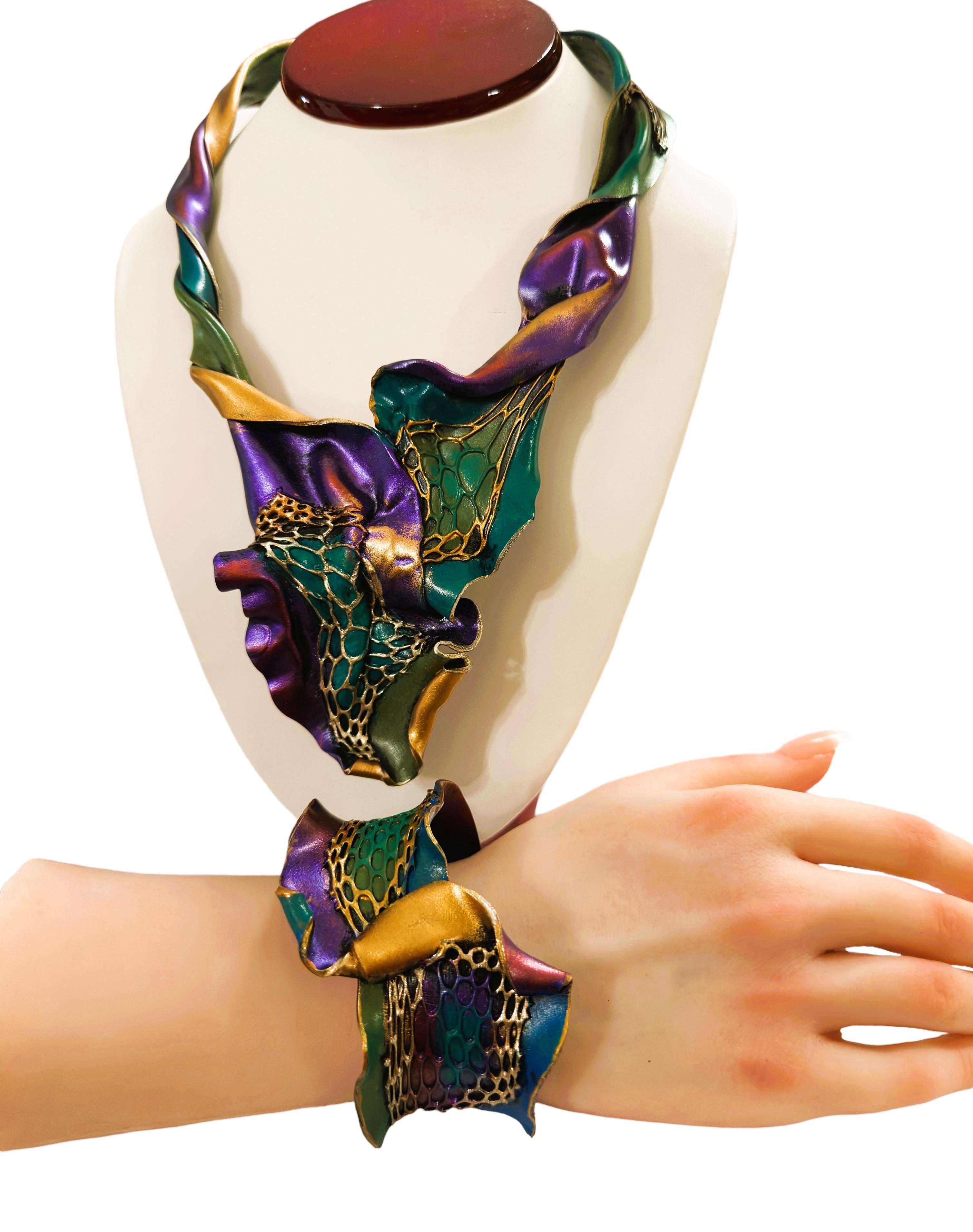 The Jeanique line is created by South African Artist Jean Houndsome.  Her creations come in bold beautiful colors. I have a matching cuff Necklace with a matching cuff Bracelet   The necklace is made to fit any size neck.  Total length of the