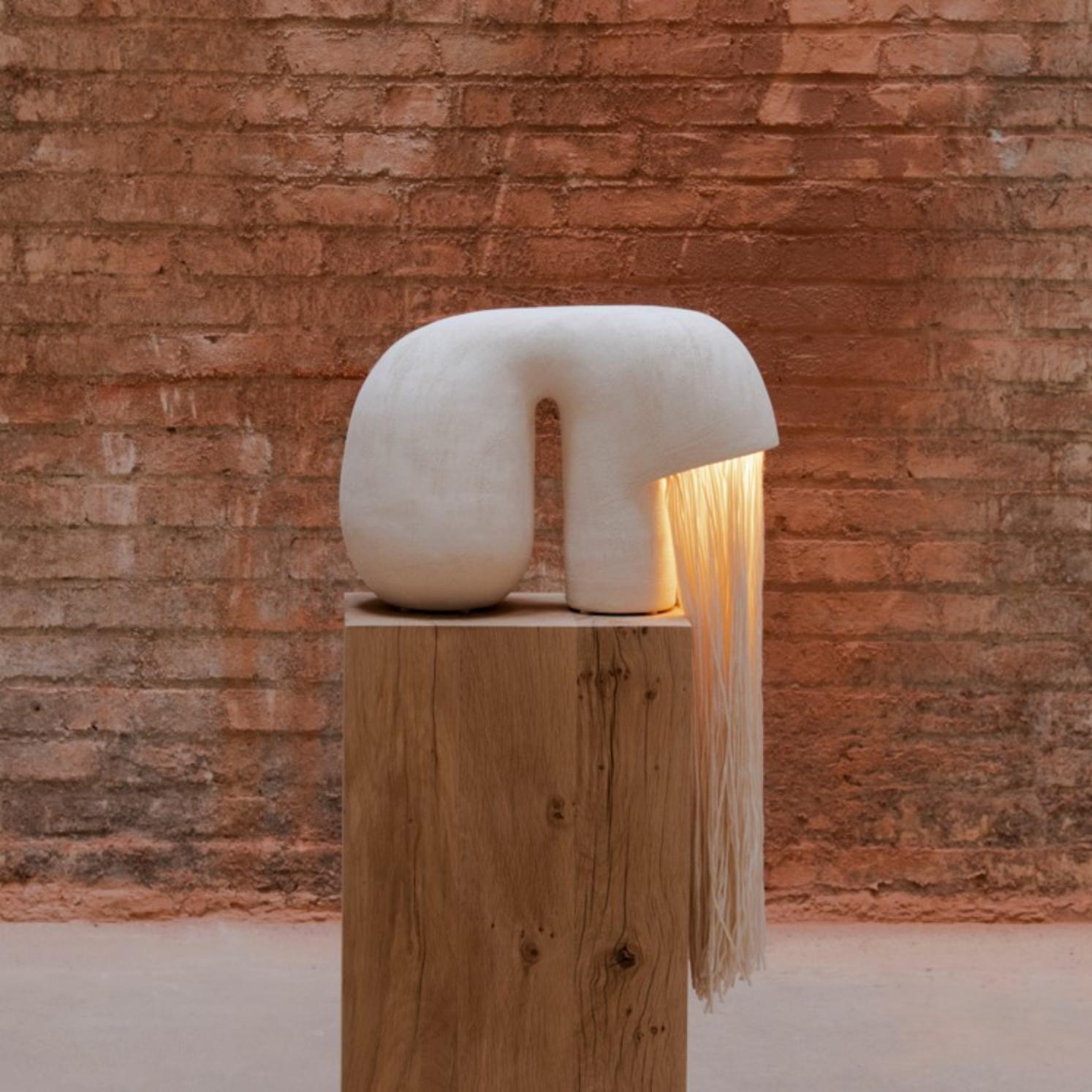 Jeanne #1 Lamp by Elisa Uberti
Limited series of 4 numbered copies + 1 AP
Dimensions: W 40 x D 15 x H 32 cm
Materials: White Stoneware.
This product is handmade, dimensions may vary. Please contact us.

(Oak stool not included, by