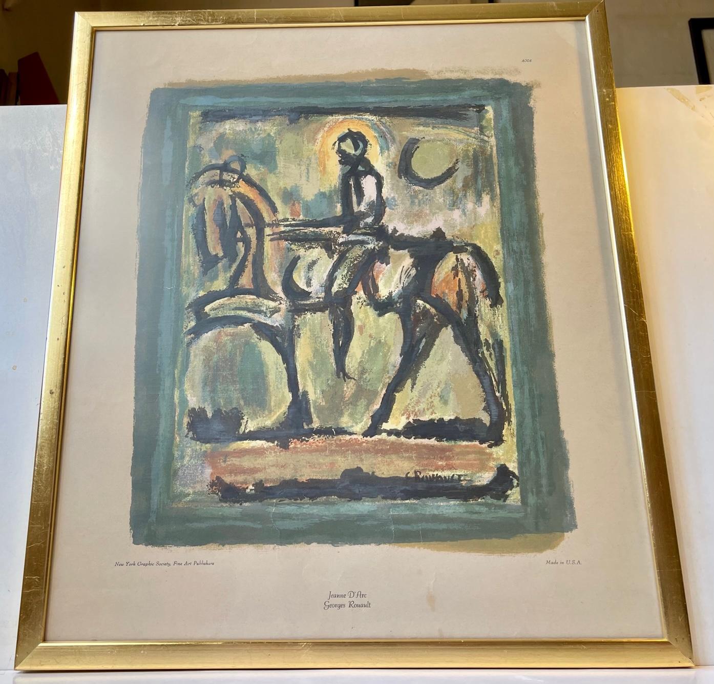 Jeanne D' Arc on horseback by Georges Rouault. Color Print number 4004 published by New York Graphic Society, Fine Art Publishers circa 1940. It is mounted in a gold-painted frame with a glass front. Measurements: 59x51x2 cm (framed).