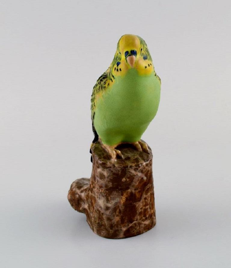 Jeanne Grut for Royal Copenhagen. Figure in hand-painted and glazed faience. Budgerigar. 1970s.
Measures: 15 x 9 cm.
In excellent condition.
Stamped.
1st factory quality.
Model number 478/3188.