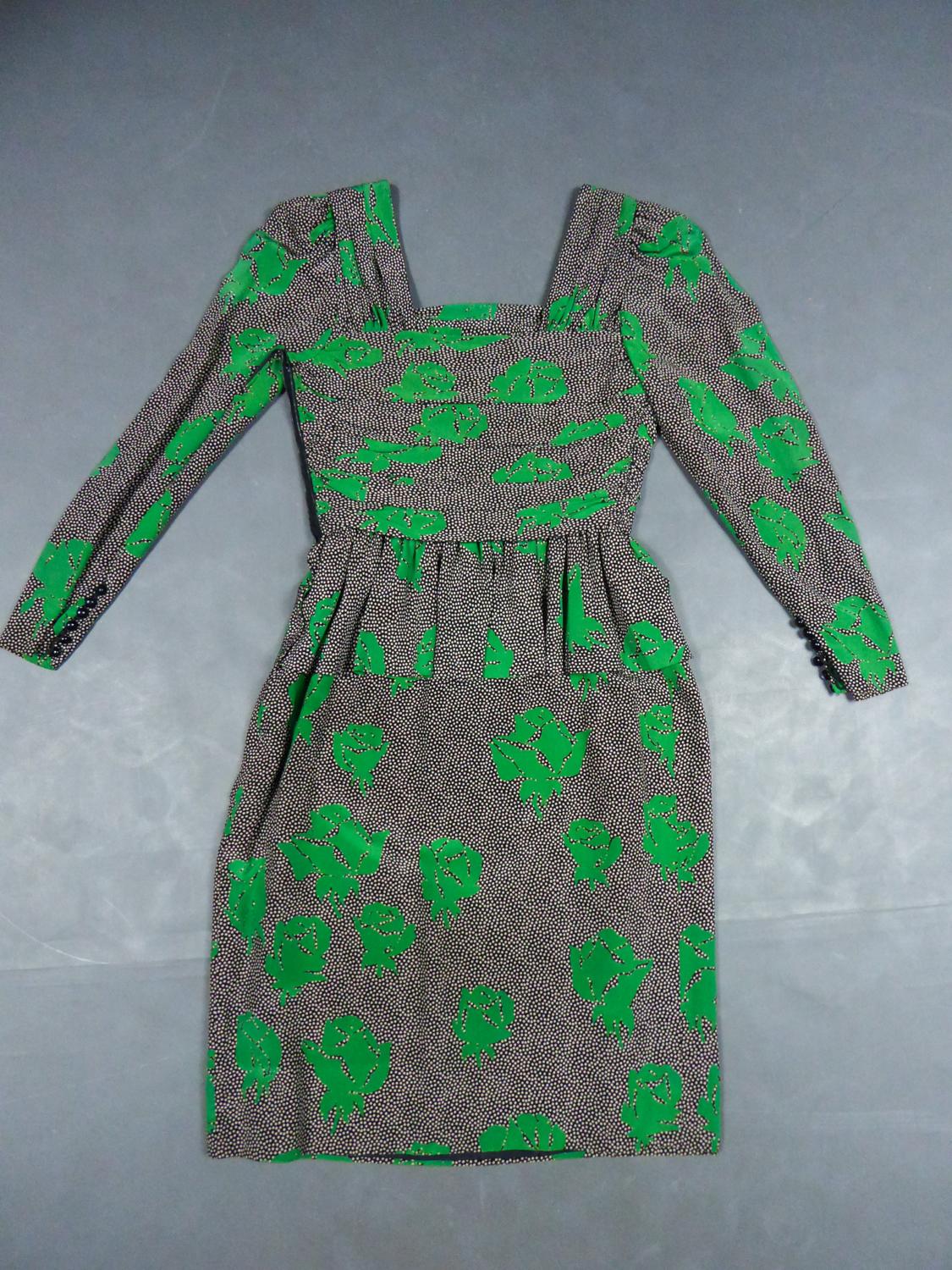 Circa 1980
France Paris

Jeanne Lanvin Haute Couture mid-length dress in printed silk by Jules-François Grahay who directed the designer house until 1984. Black silk crepe printed with white dots and stylized green roses arranged randomly. Dress