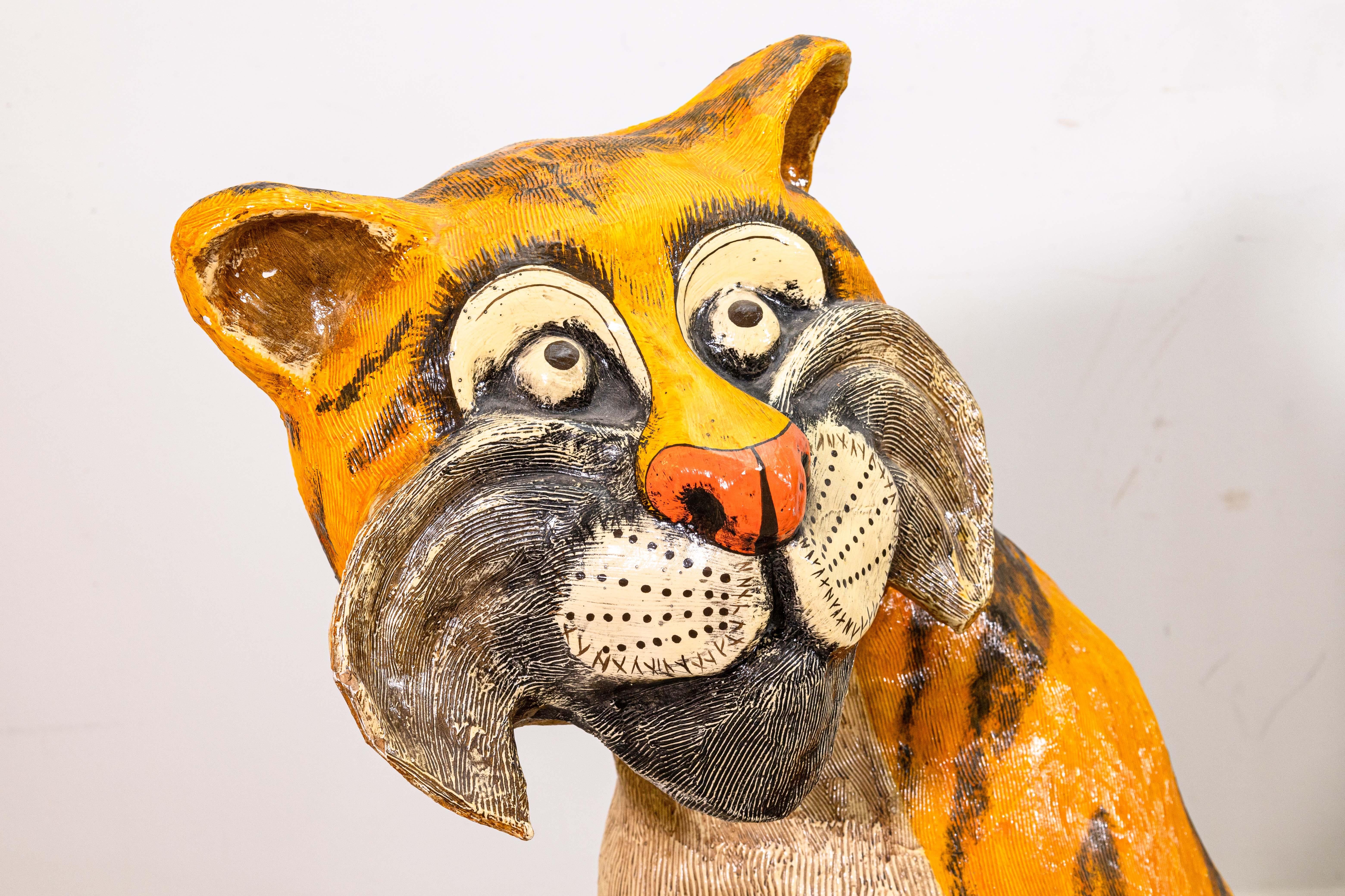 A mid-century modern papier mache sculpture depicting an endearing and delightful tiger by French artist and designer Jeanne Valentine S.A. Made circa 1960s at the artist's studio located in San Miguel de Allende, Mexico. Original tag on bottom.