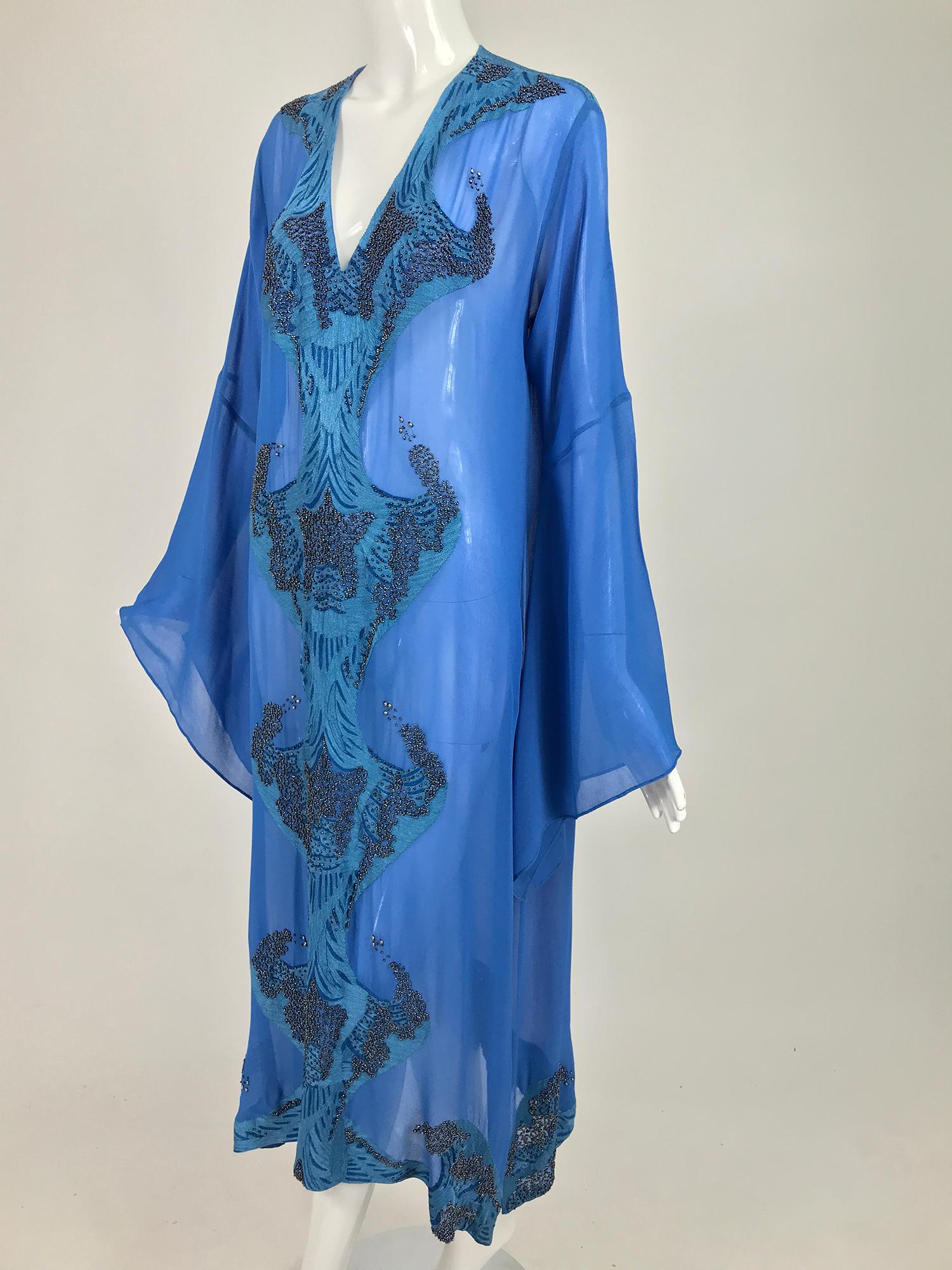 Jeannie McQueeny beaded blue silk chiffon caftan, dress. From the Bahamas, Jeannie McQueenie is known for her exotic, beautifully made caftans. This one is in a deep shade of blue with unique embroidery and bead work. Marked size large.
    In