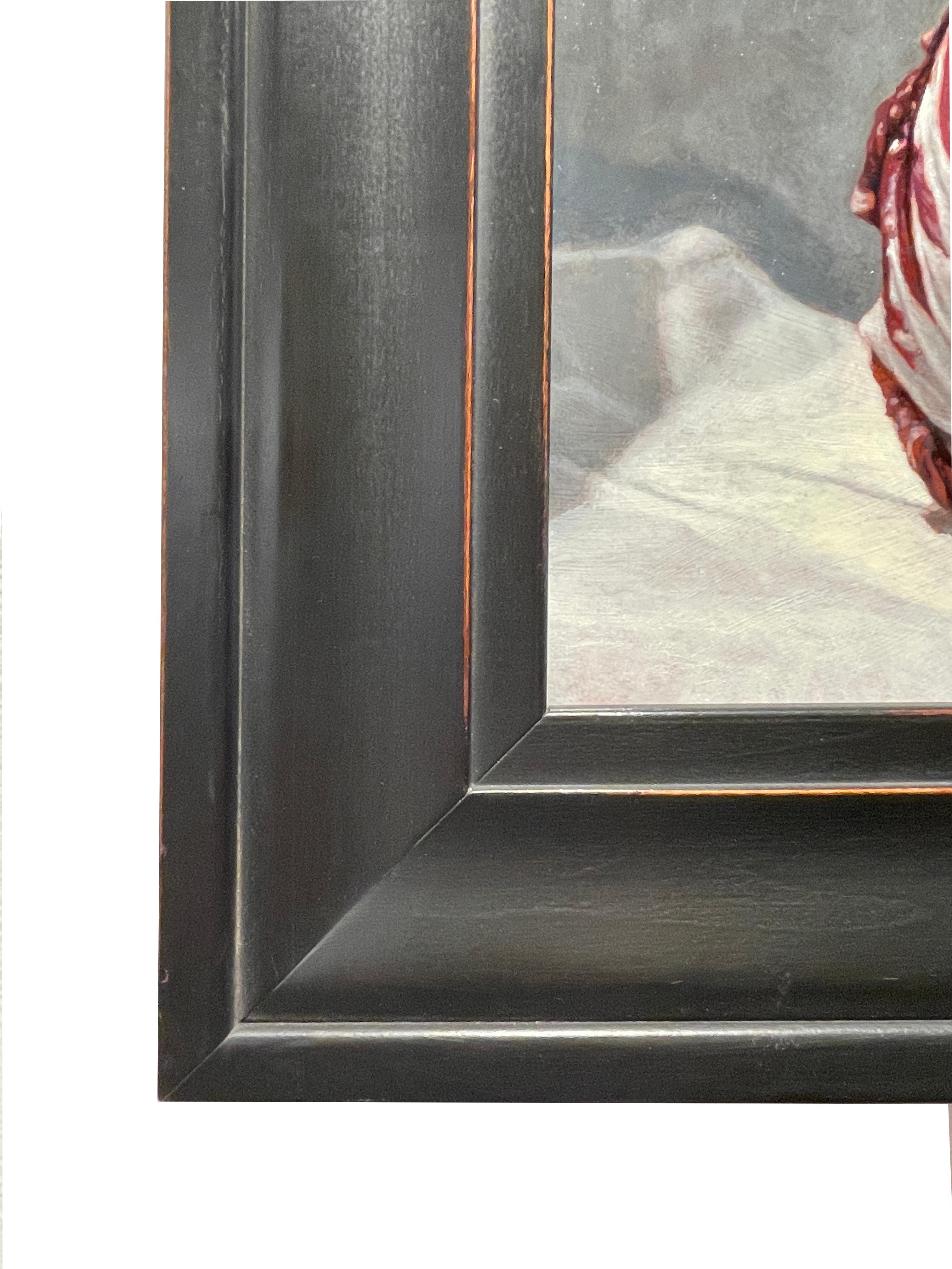 A simple head of radicchio sits upon a piece of satin cloth yet its complexity draws us in to examine the exquisite detail, the softness of the fabric, the surface of the lettuce.  This still life is enhanced by the hand made wooden frame measuring