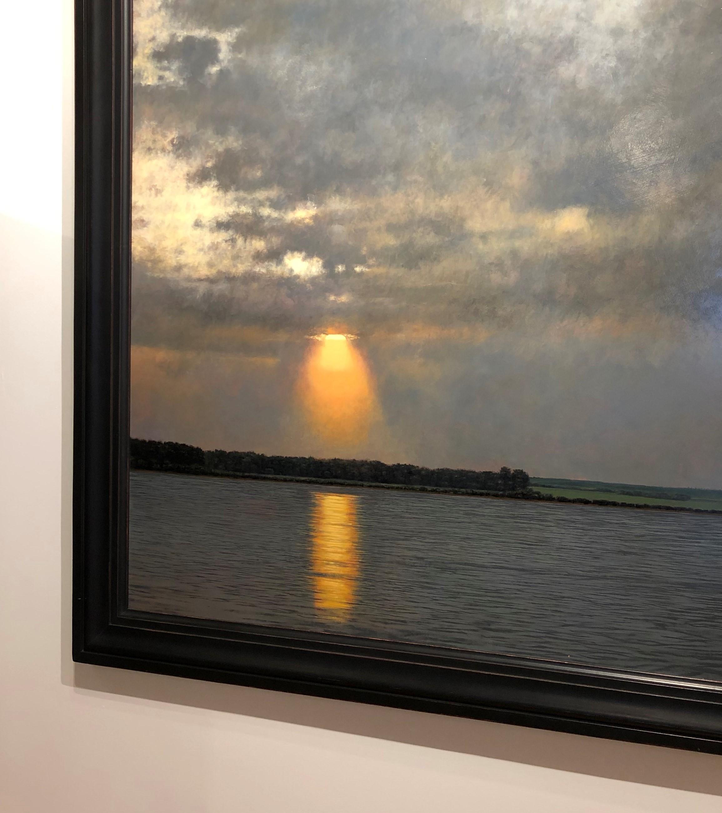 This large oil on panel painting by Jeff Aeling entitled Setting Sun has a cool grey sky with a blazing sun set.  The sun burns though the clouds to reflect this intensity on the water below.  The loose brush work comes together to give a photo