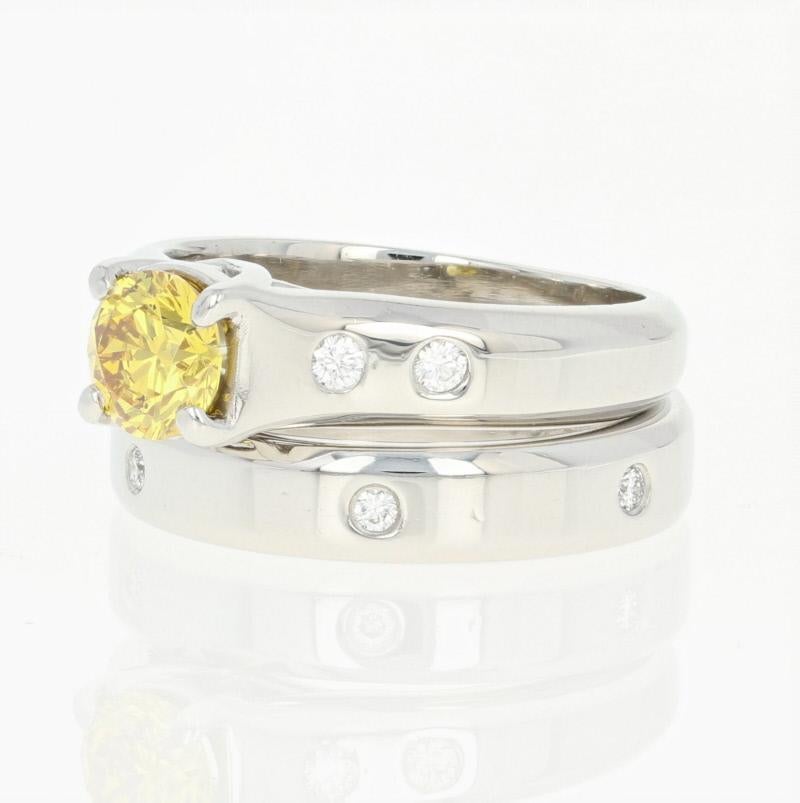 Give your sweetheart a stunning, artistically beautiful wedding set of exquisite craftsmanship she will cherish forever! Created by Jeff Cooper in heirloom-quality platinum, this sleek, contemporary engagement ring showcases a vivid yellow diamond