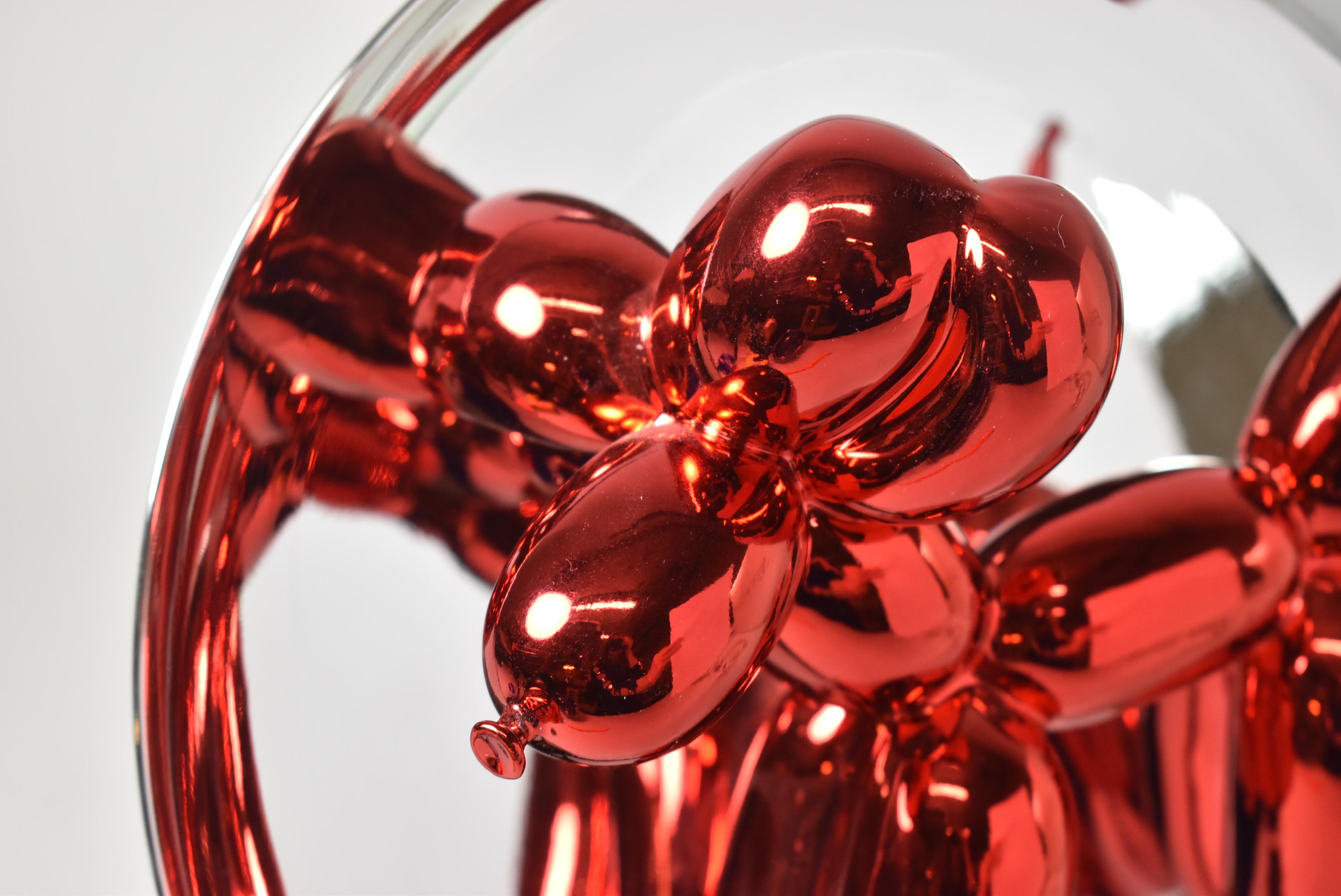 Jeff Koons pop art sculpture Red Balloon Dog, number 1645/2300, 1995. Chromed back plate with a porcelain red balloon dog, label on the back. The plate is 10 1/2