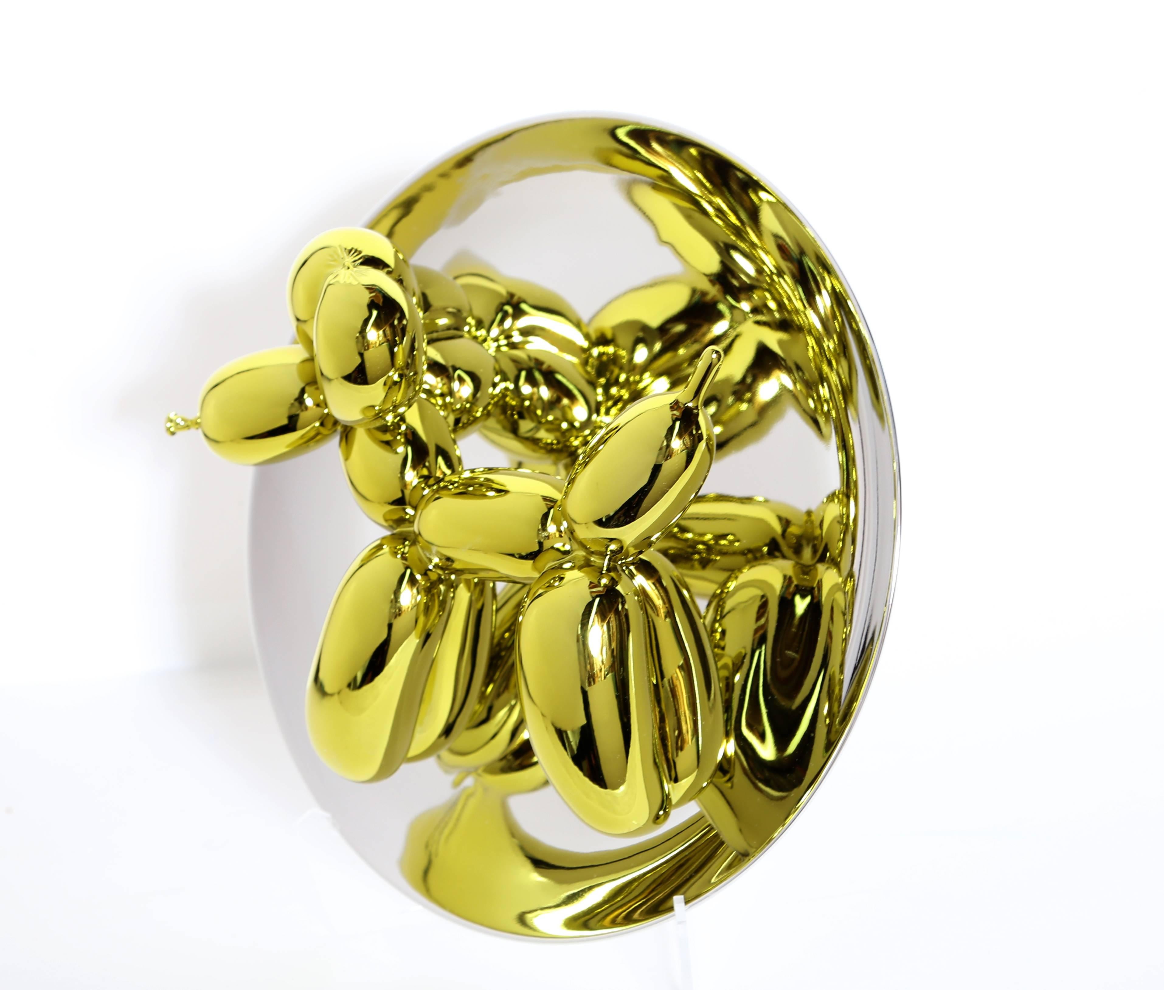 Artist: Jeff Koons, American (1954 - )
Title: Balloon Dog (Yellow)
Year: 2015
Medium: Porcelain with Mirror Finish, signed and numbered verso
Edition: 2300
Size: 10.5 x 10.5 x 5 in. (26.67 x 26.67 x 12.7 cm)
Includes all original packaging.