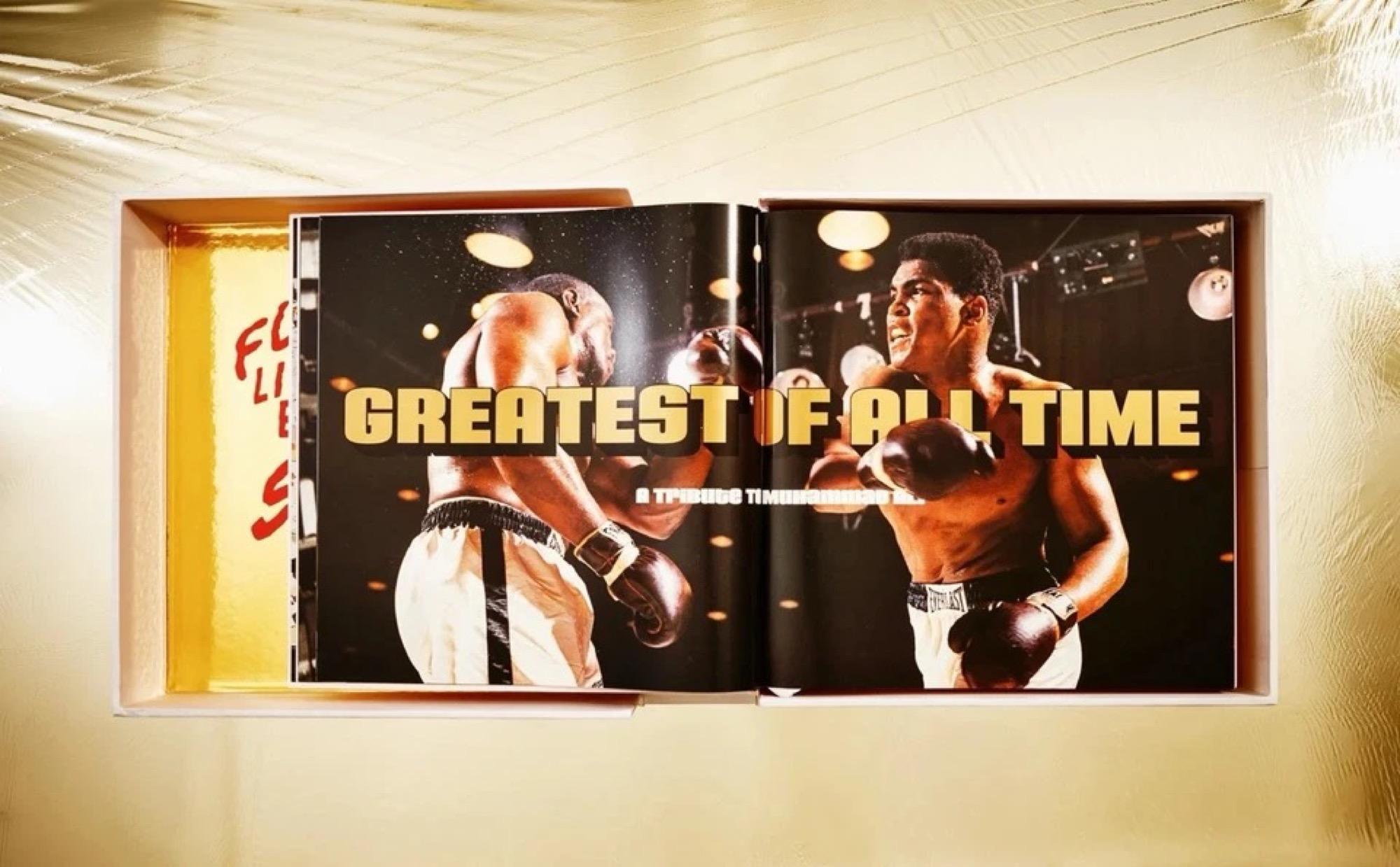 Jeff Koons, GOAT: A Tribute to Muhammad Ali - CHAMP

Hardcover in clamshell box with four prints and sculpture, 792 pages

50 x 50 cm (20 x 20 in)

The sculpture Radial Champs by Jeff Koons

Comprised of two inflatables and a stool

175 x 170 cm (69