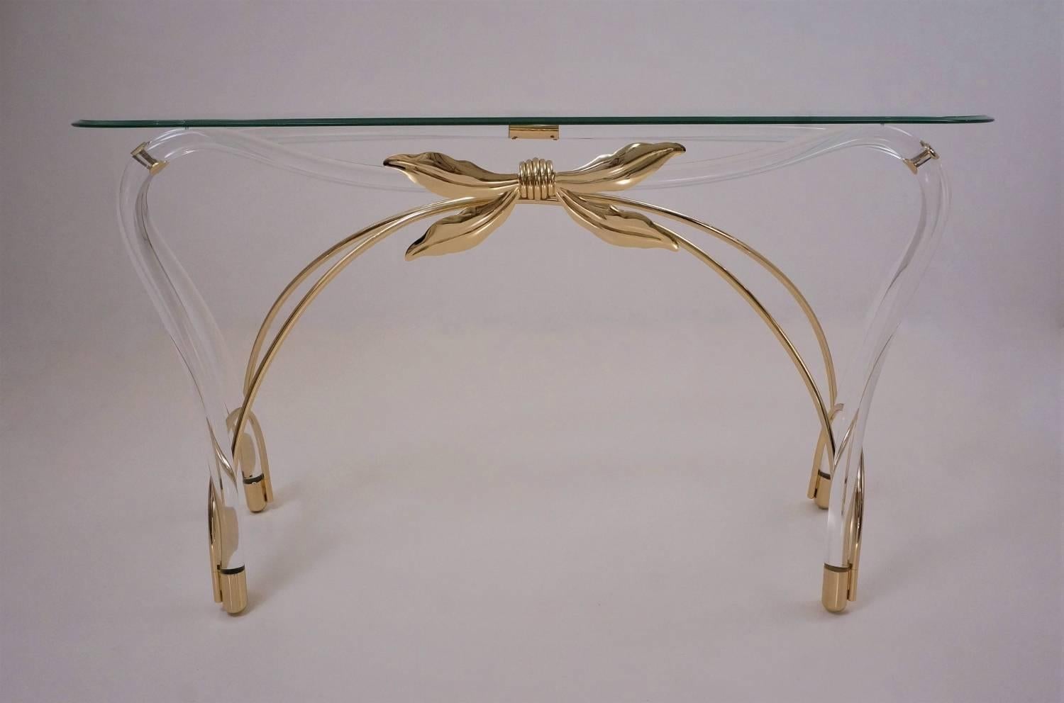 Jeff Messerschmidt console table, Lucite, gold plated gilt and glass, circa 1970s, American.

This console table has been gently cleaned while respecting the vintage patina and is ready to use. The curving glass top with bevelled edge is original