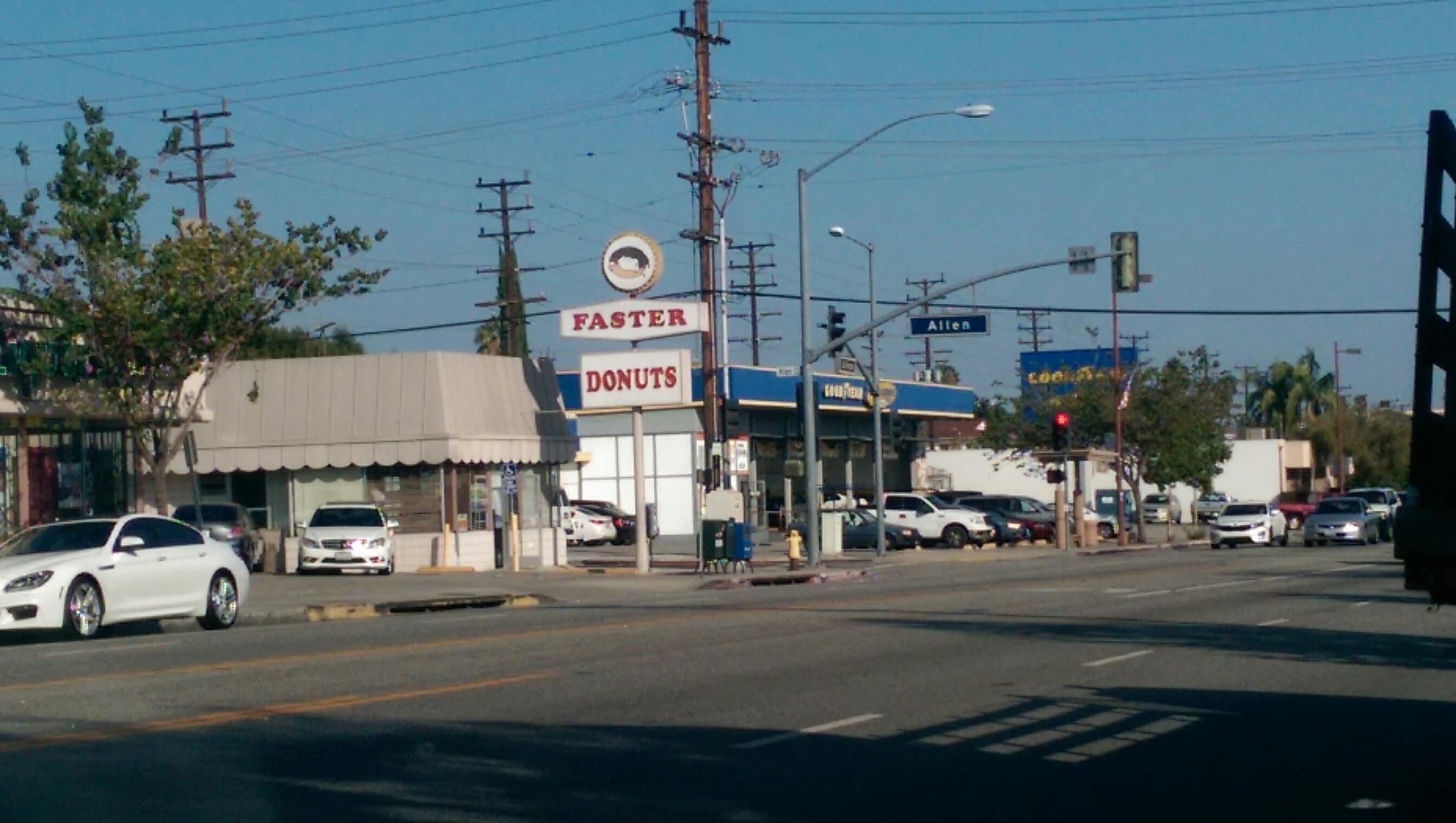 Faster Donuts was painted plein air .  .There is the use of the palette knife which builds up a texture of the oil paints used in this  road stop donut shop which are almost nonexistent today in America..   The paintings is framed. Faster Donuts are