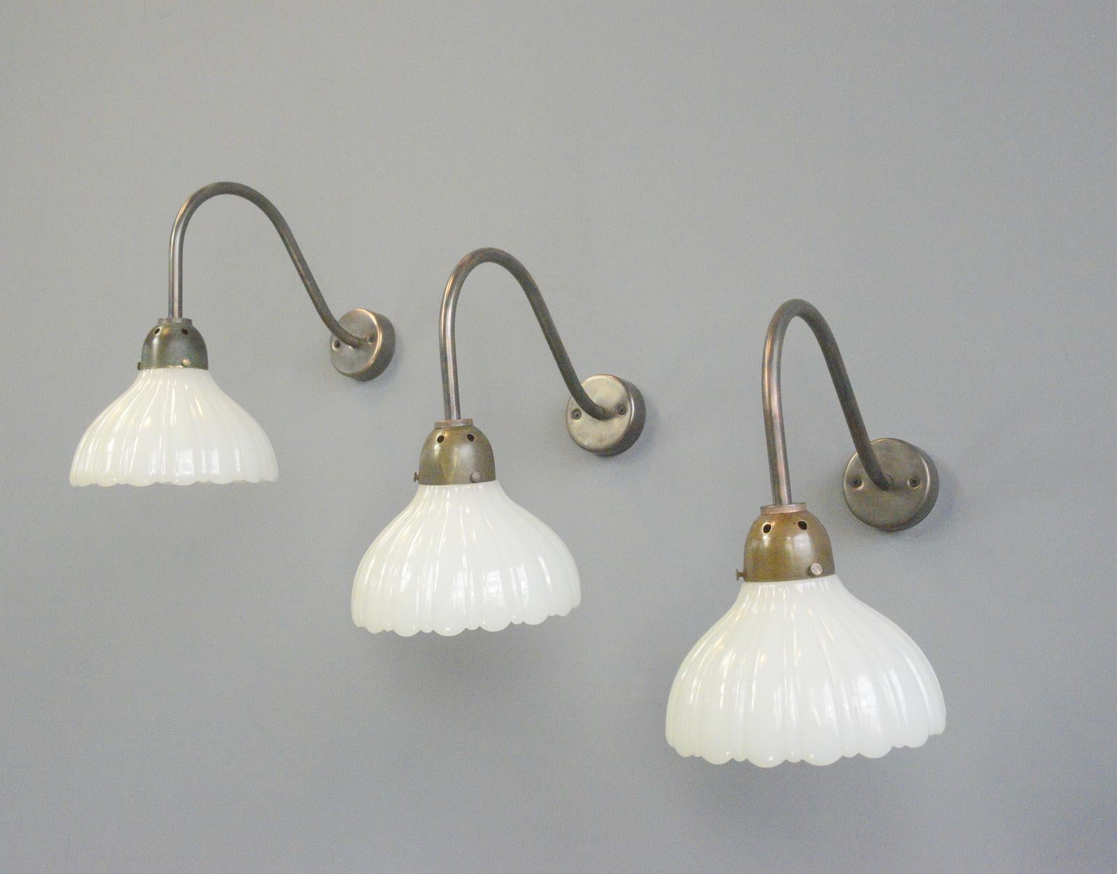 Jefferson moonstone wall lights Circa 1910.

- Heavy opaline glass shades
- Copper tops and brackets
- Takes E27 fitting bulbs
- Wires directly into the wall feed
- English ~ 1910
- 19cm wide x 32cm deep x 34cm tall

Condition
