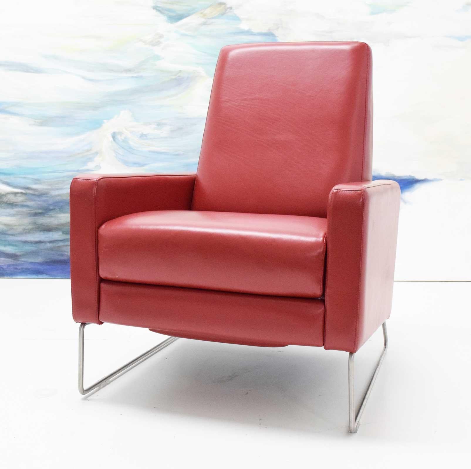 Executed in red leather with a chrome base. Looks great. 
Armed with experience designing ergonomic in-flight seating for private jets, Bernett knew how to create a comfortable chair with none of the bulkiness or macho pretense of a traditional