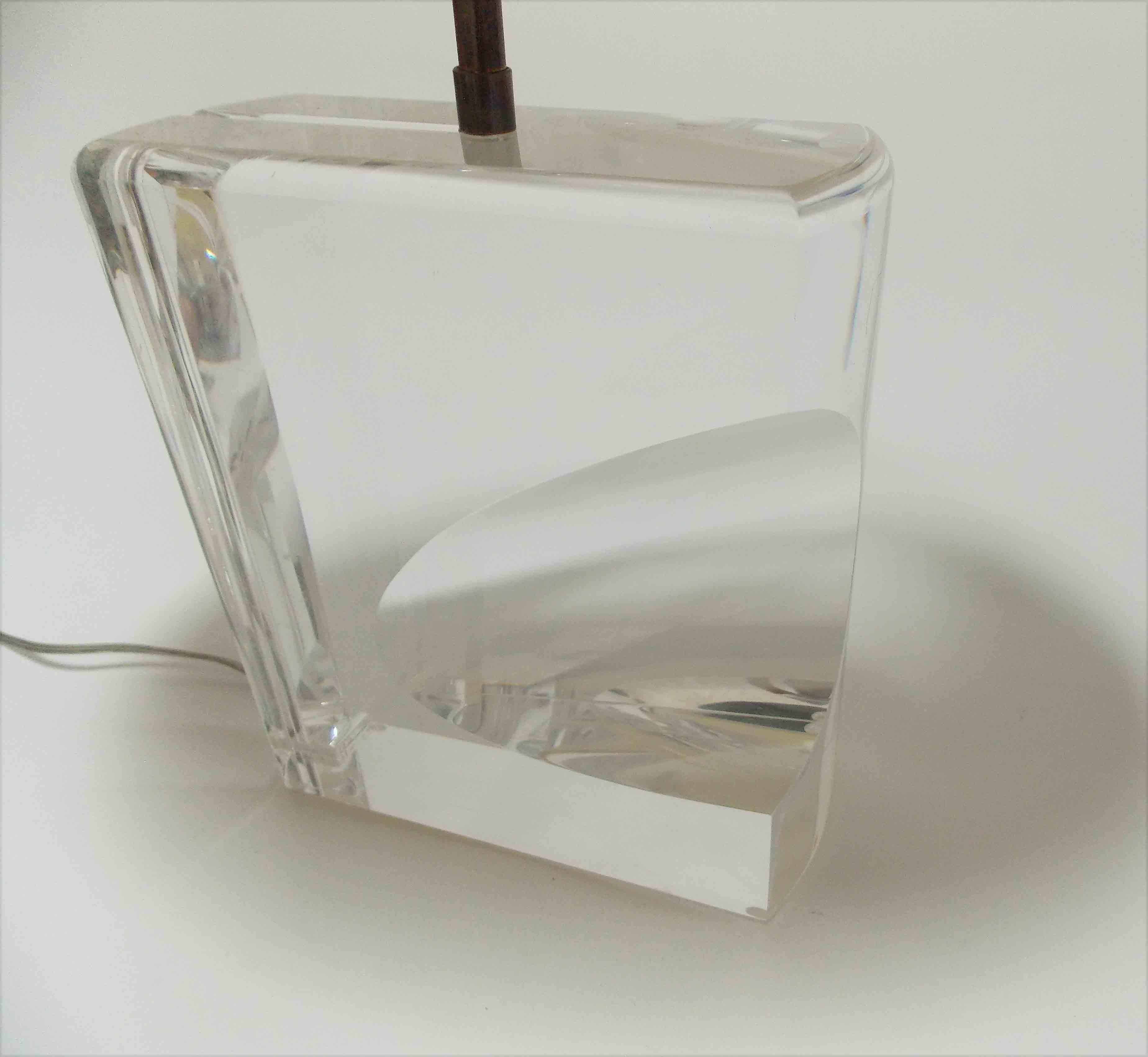 An acrylic lamp with an optical presence.