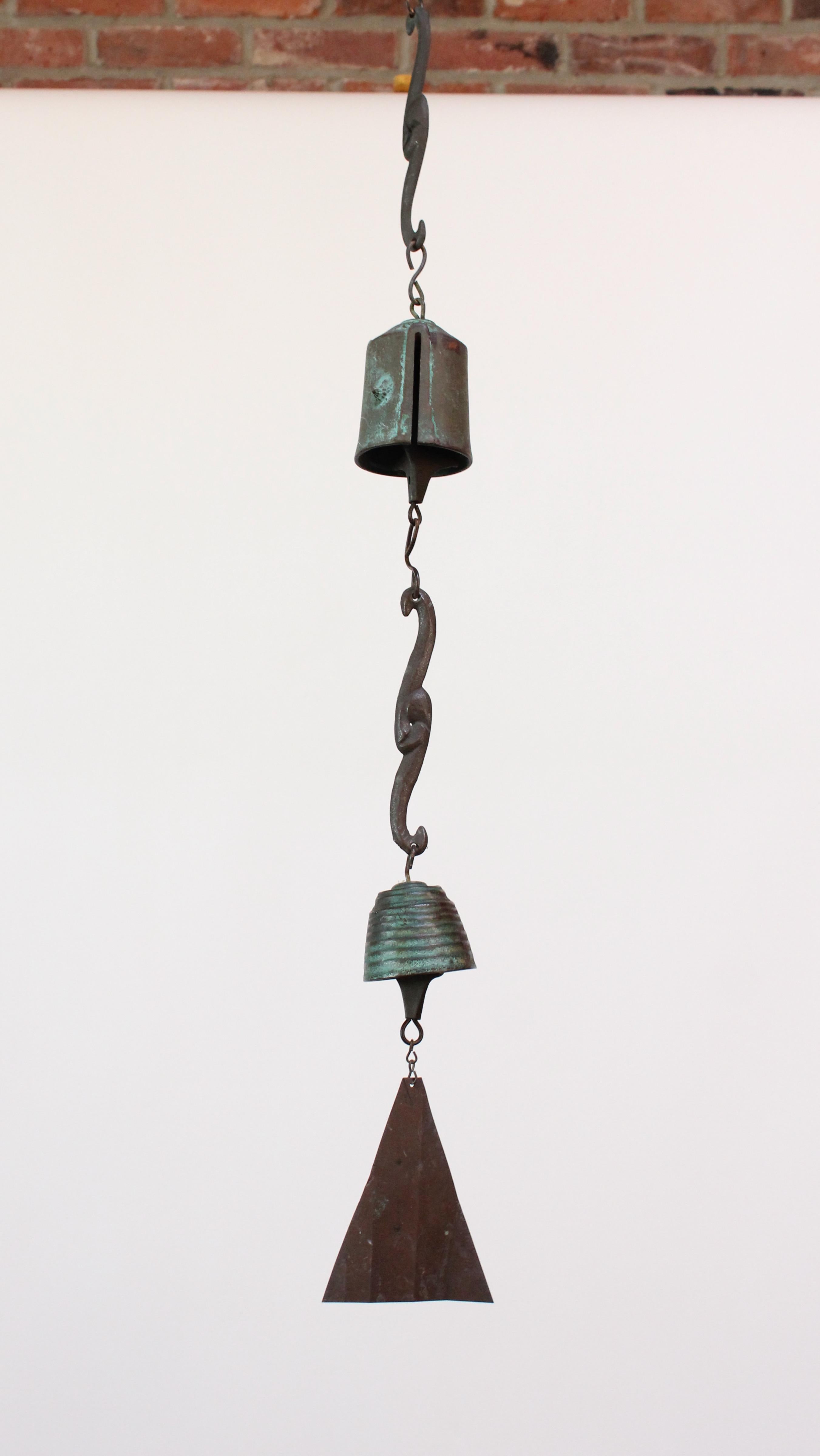 Wind chime / bell designed by Jeffrey Cross for Harmony Hollow Bell Works ca. 1970. 
Bronze cast elements with verdigris patina throughout from natural age and environmental weathering. 
Incised HHBW signature present to the tops of both bells.