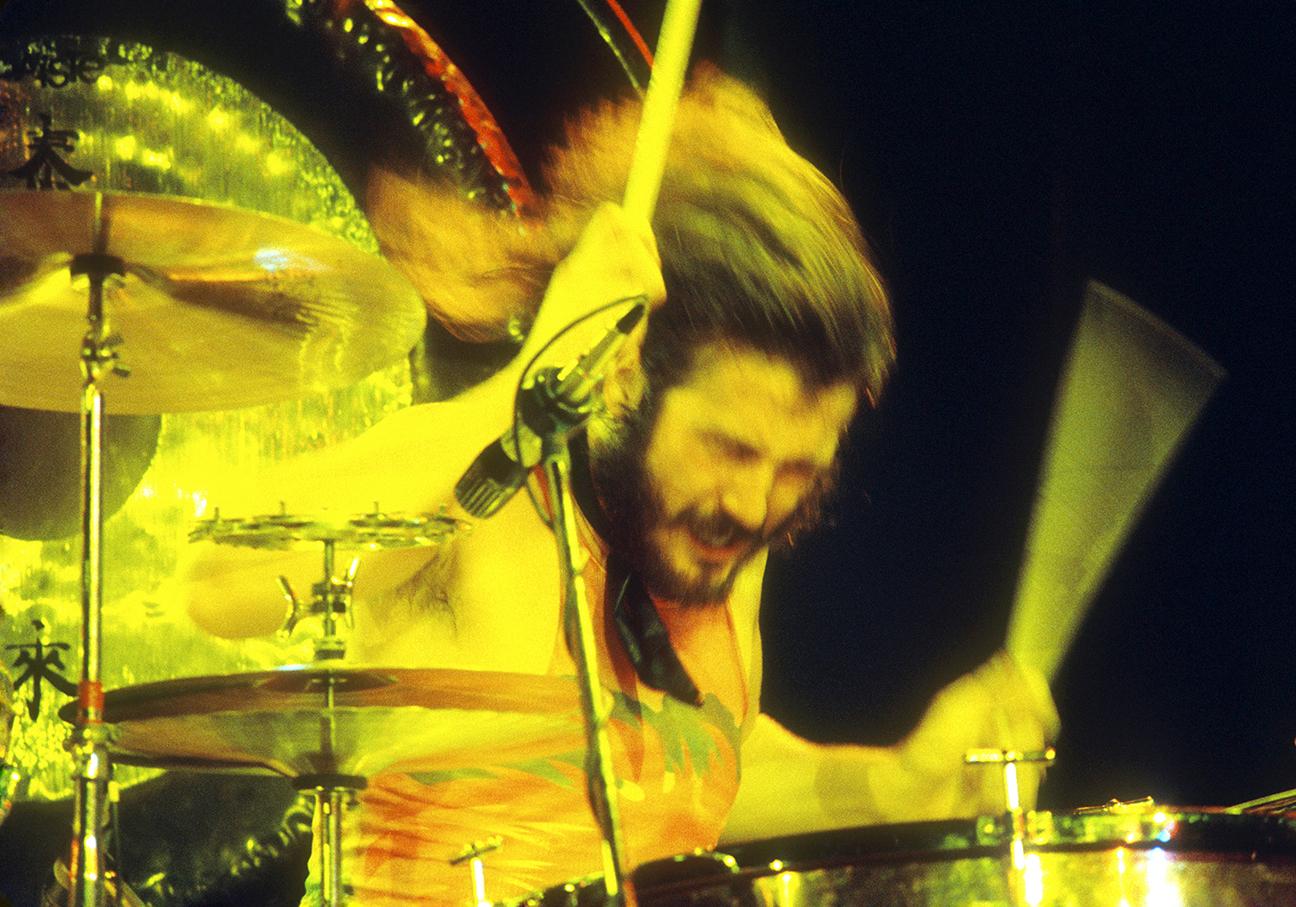 Dramatic Photograph of Led Zeppelin’s John Bonham playing a drum solo at the Forum in Inglewood California in 1972.

Limited edition print signed and numbered by Jeffrey Mayer in the lower margin, archival pigment on 100% cotton paper with a Baryta