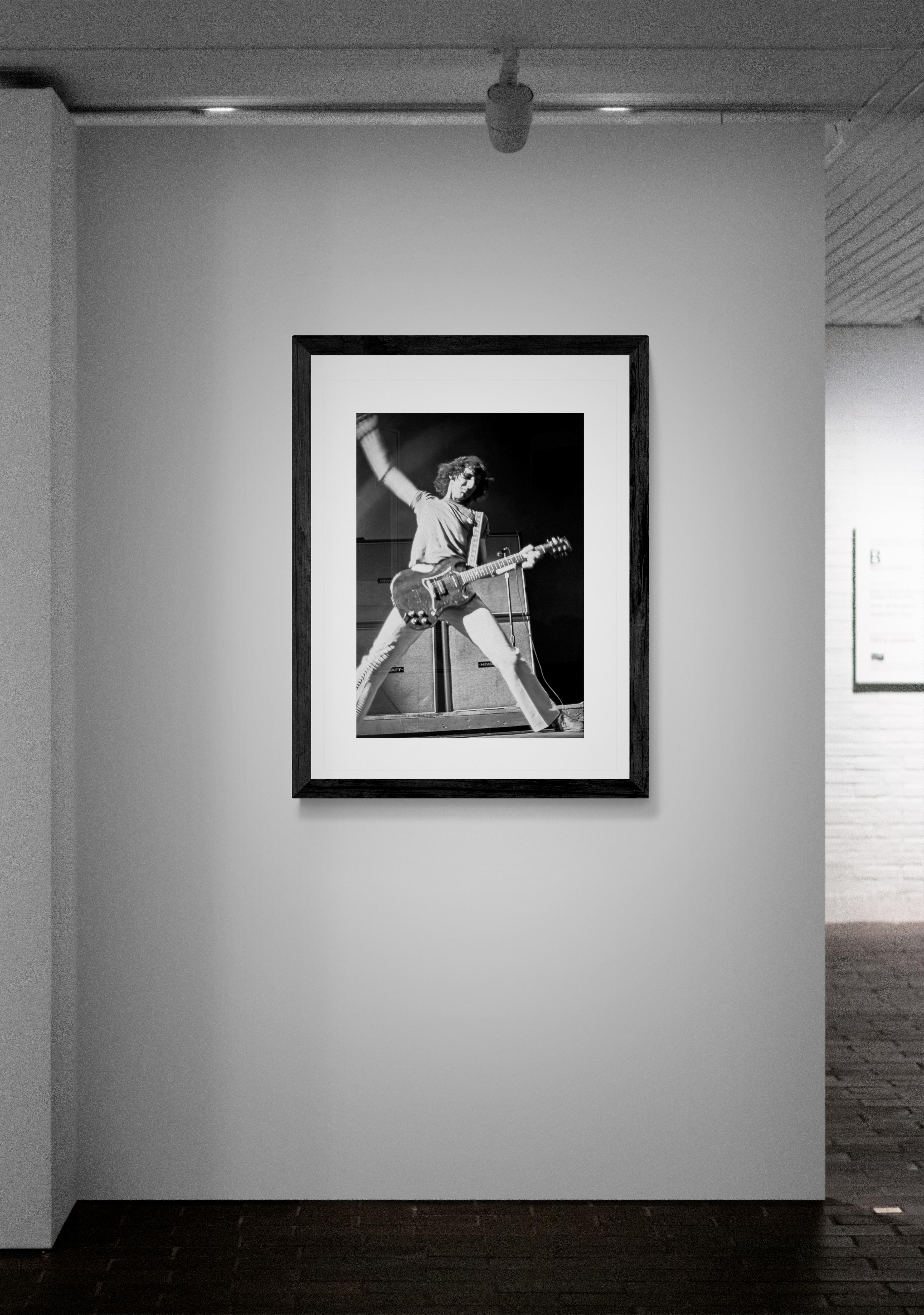 Pete Townsends’s trademark windmill style guitar playing is captured while The Who tours in support of their seminal album ‘Who’s Next” in Forest Hills, New York, 1971. 

Artist: Jeffrey Mayer
Limited Edition: Signed and hand numbered in the margin,