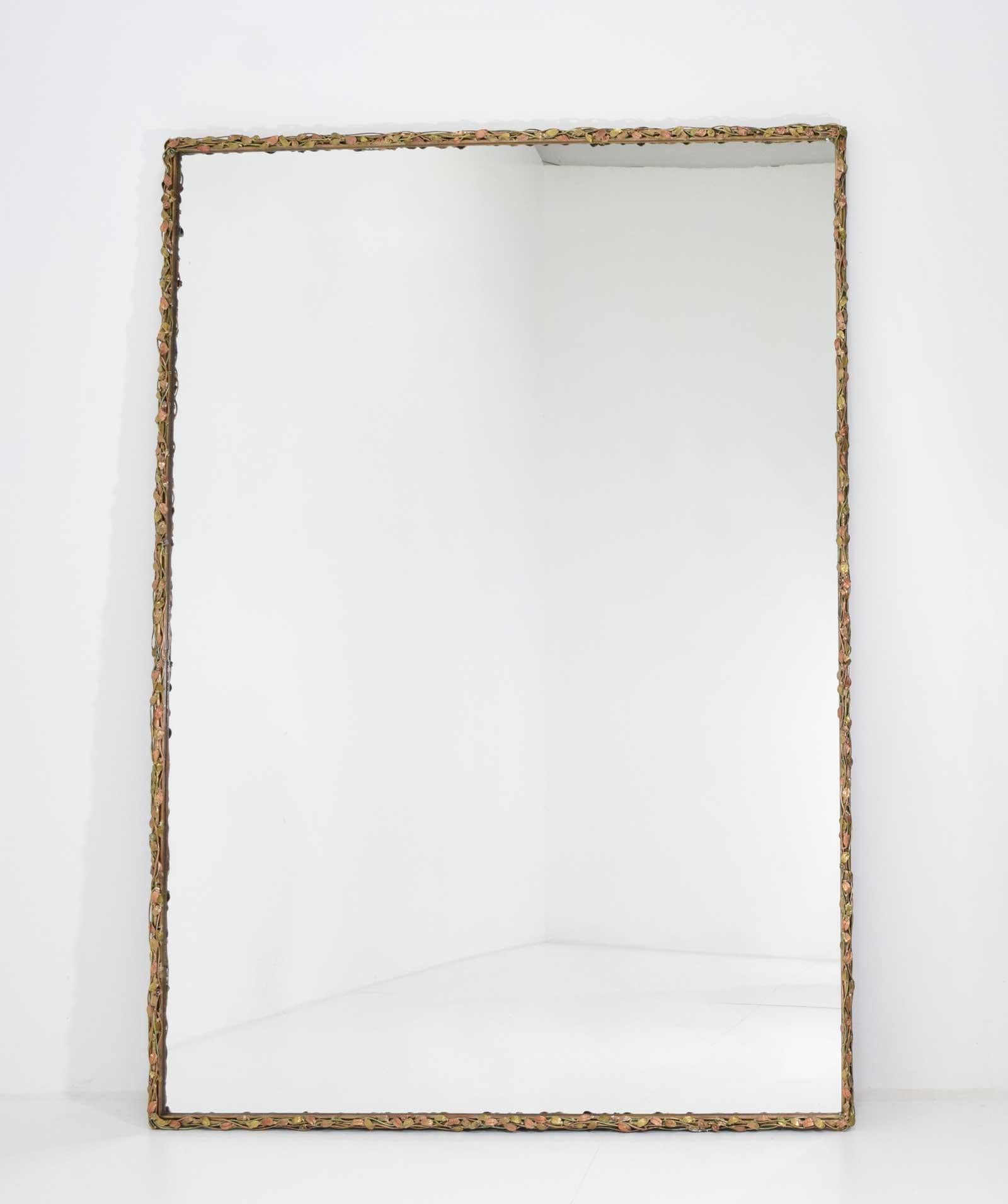 Large bronze framed mirror by sculptor Jeffrey Sass for private collection, 20th century.
Thin frame with brass and copper-finished vines decorated with applied 