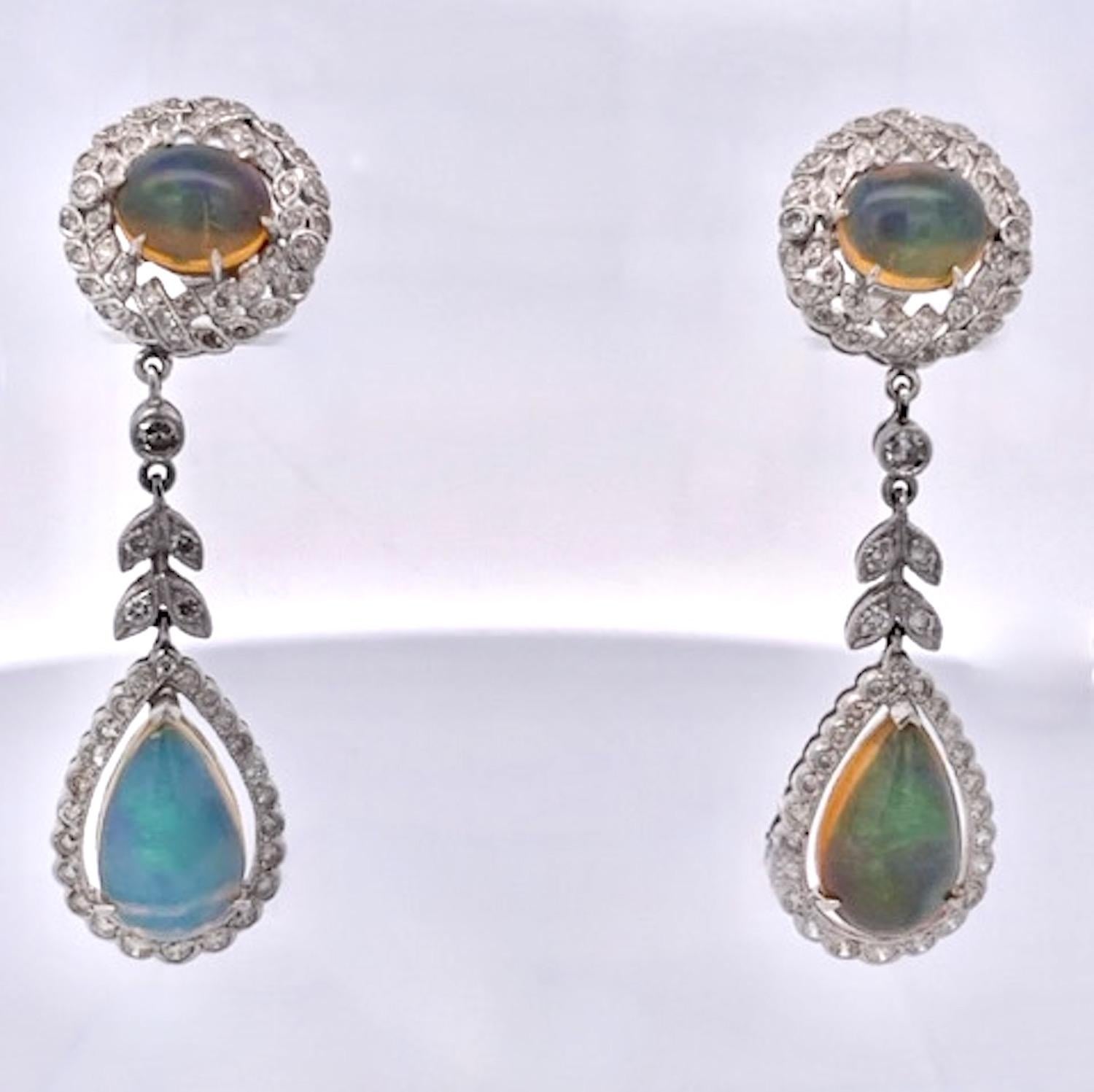 These beautiful Jelly Opals are special.  These Jelly Opal Drop earrings are 4.5cm long with a pear shaped Opal drop of approximately 4 carats and a top Round Opal of 2.25 carats to total 12.50 carats.  These Opals have a Diamond surround on both