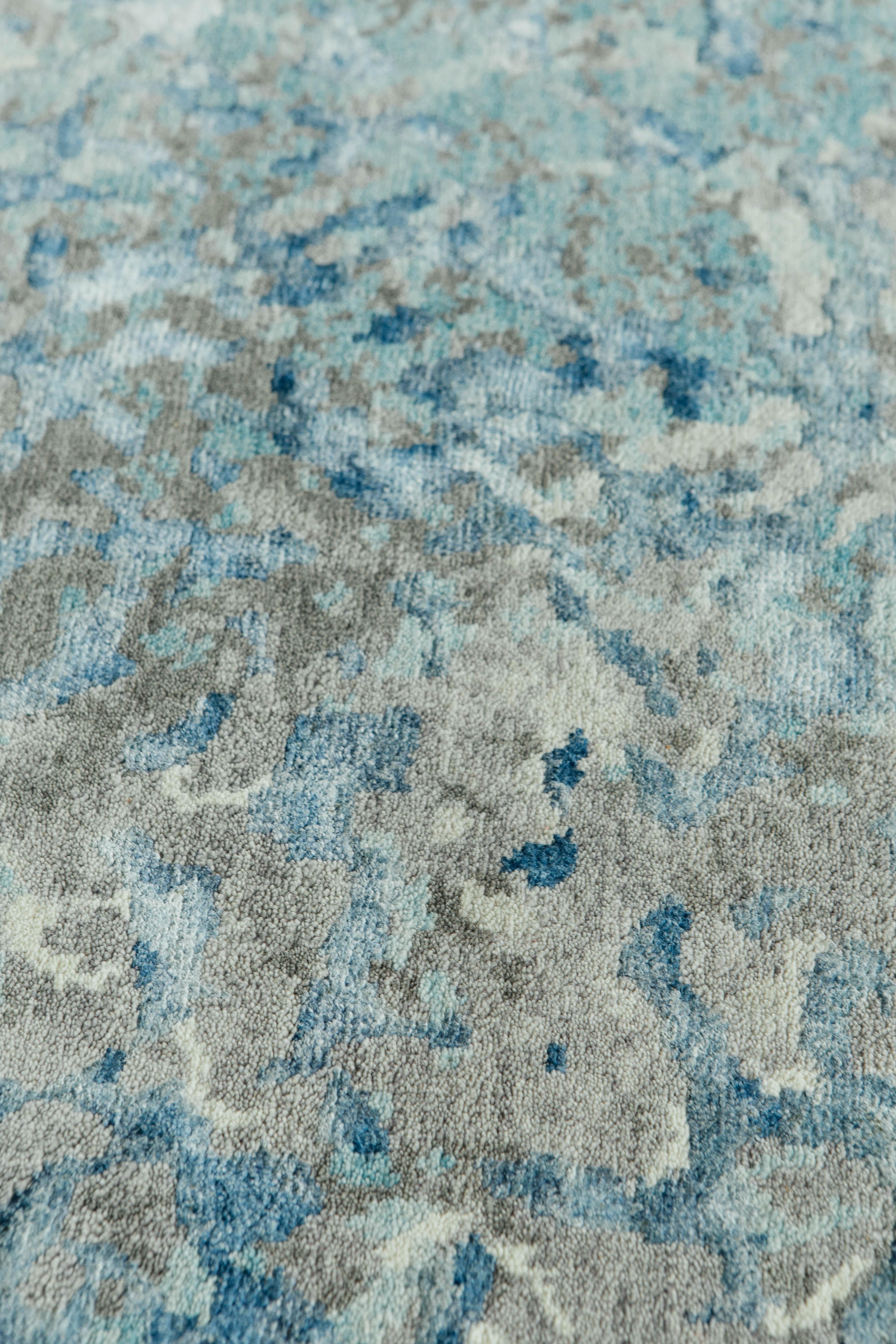 Interweaving soft blues and grays create the emergence of beautiful floral patterns. The lustrous wool and silks bring movement to the rug especially when light refracts throughout the day.



Rug number: 25857
Size: 9'2