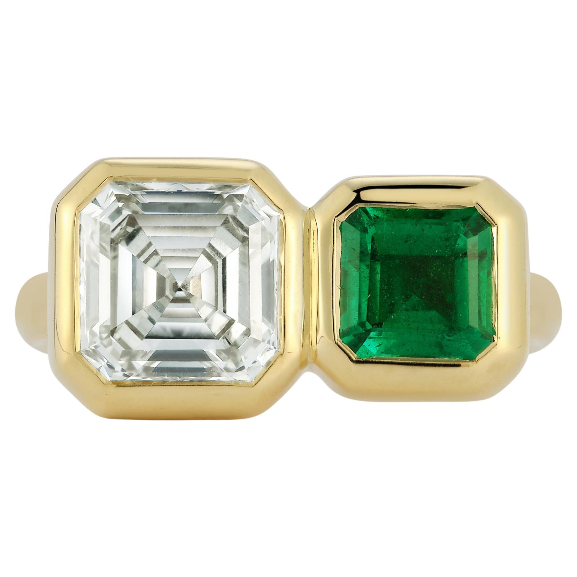 Our Diamond and emerald Duo Ring is a one of a kind piece. The diamond is an Antique stone repurposed from an old estate piece of jewelry. The cut and color is magical! 
The emerald is a rich kelly green of Zambian origin. The mix of Diamond and