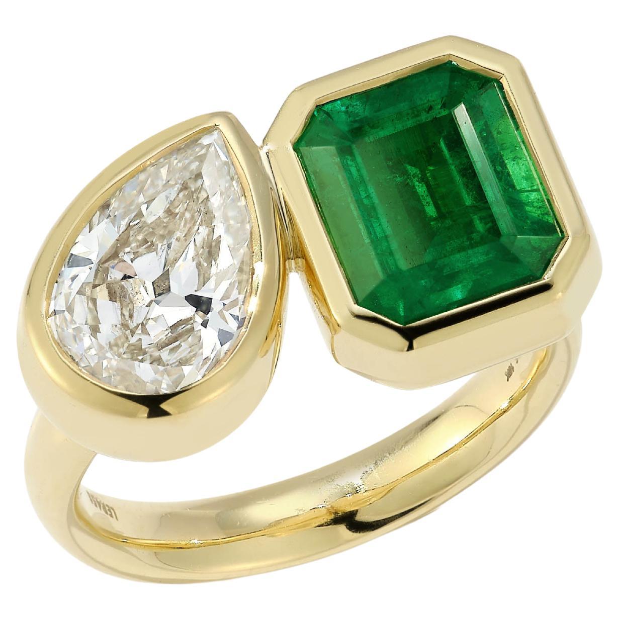 Our one-of-a-kind two stone ring is constructed in our rich 18K yellow gold and deep green colored Zambian emerald and Pear shaped diamond. It is an amazing and unique engagement ring or the perfect right hand ring for everyday.
At Jemma Wynne, we