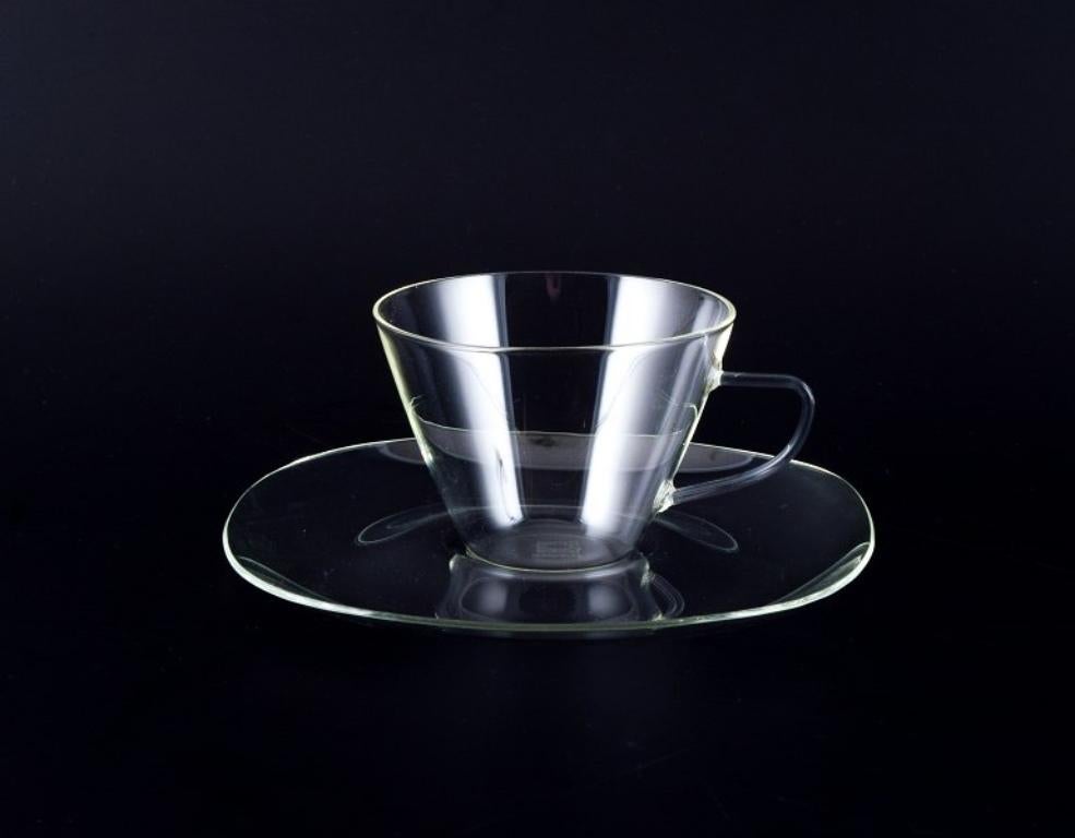 Jena-Glas, Schott & Gen/Mainz, Germany. 
Four coffee cups with saucers. Bauhaus style.
Circa 1940s.
Marked.
Perfect condition.
Saucer: Diameter 15.5 cm.
Cup: Height 6.0 cm x Diameter 8.5 cm.
