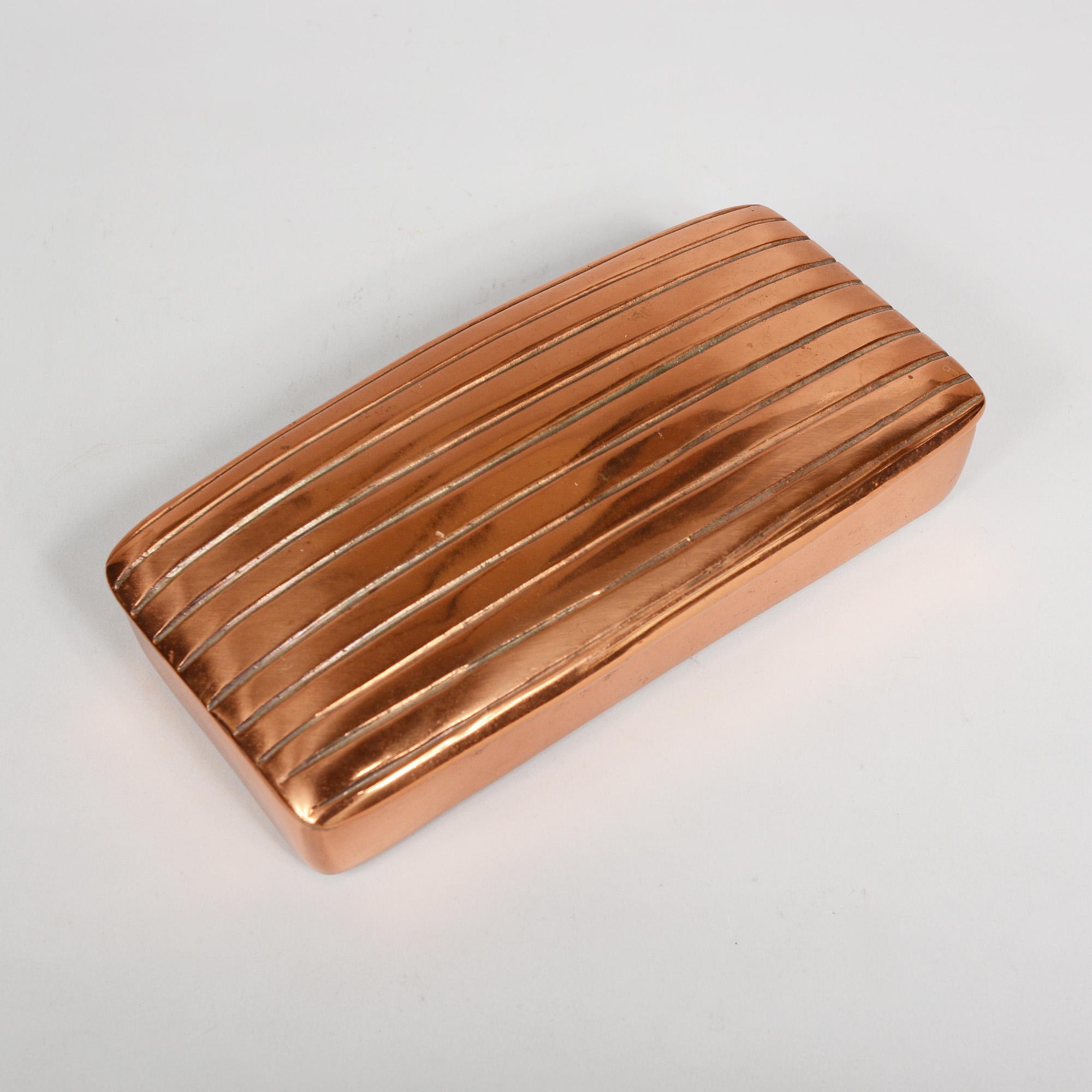 Stash or trinket box with a copper finish designed by Ben Seibel. This box was part of the Jenfred-ware line for Raymor.