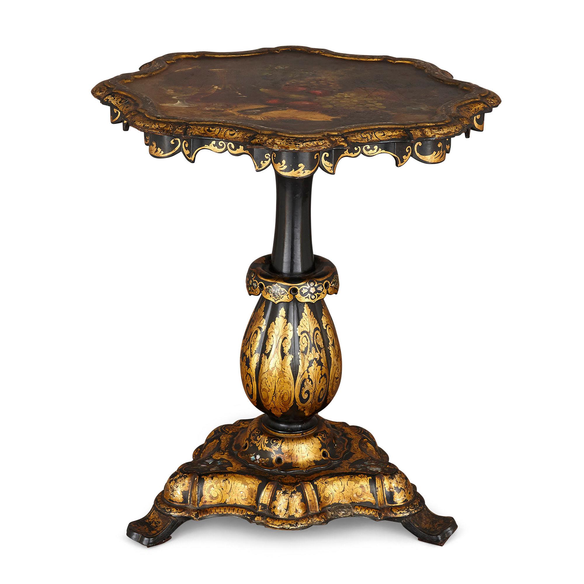 Jennens & Bettridge ebonised wood papier mâché side table
English, c. 1840
Measures: Height 72cm, diameter 63cm

The table surface has been japanned, meaning that it has been applied with layers of thick black varnish in imitation of Japanese