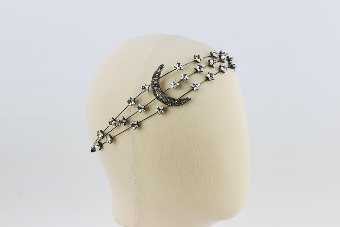 Jennifer Behr Celestial Selne crystal embellished headband. Made from gunmetal-tone hardware with crystal-embellished stars and half moon, it has an elastic band to keep it secure on your head. Silver. Pull on. Does not come with box or dustbag.