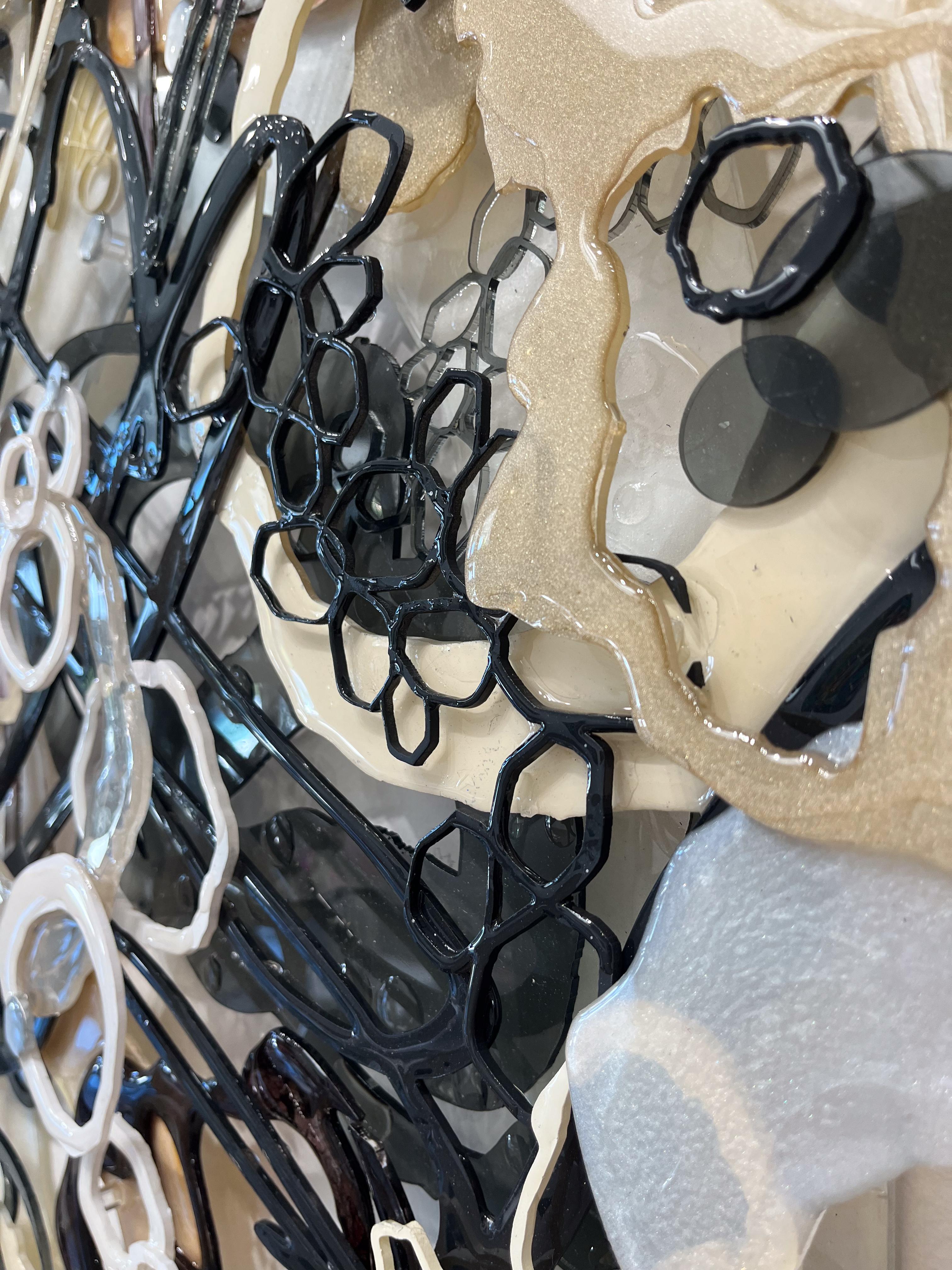 ABOUT THE ARTWORK

An opulent mixed-media marvel, woven from the intricate interplay of acrylic, ink, epoxy, and laser-cut plexiglass. Overlapping forms gracefully traverse the composition in sophisticated neutral tones encompassing grays, beige,
