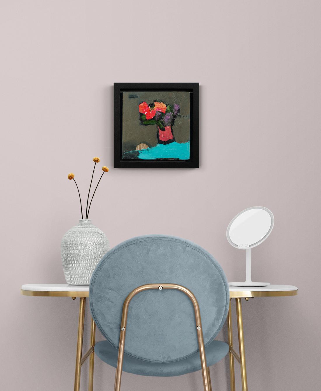 A single neon-red bloom pops from the background in this lively still life by Jernnifer Hornyak. Known for her non-traditional florals and her inspired palette— Hornyak’s flowers sit in a dark red vase against a bright turquoise cloth and gray-green