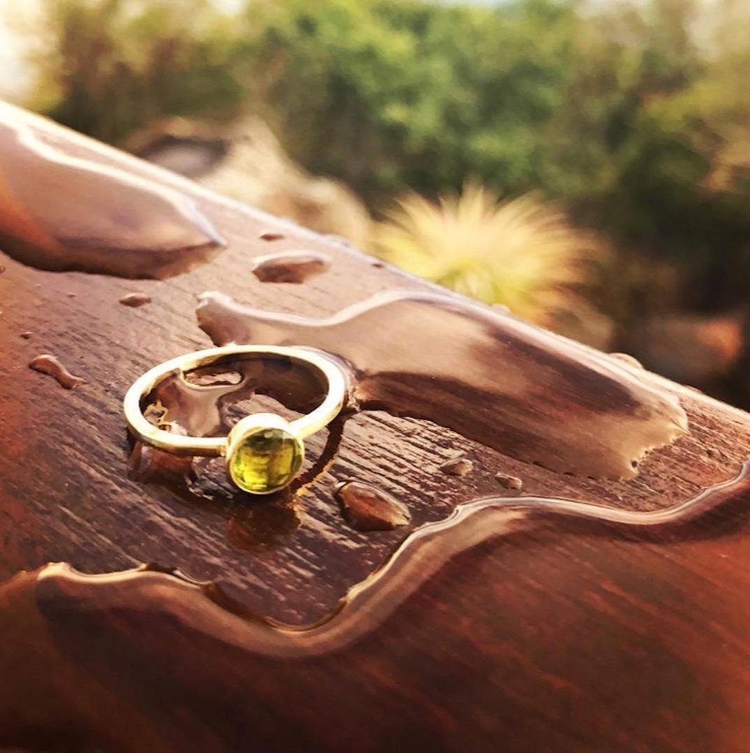 14kt gold stackable gemstone ring with a green peridot stone. Additional gemstone and band size options available upon request. 

Due to the unique quality of our hand picked stones, no two stones are identical.