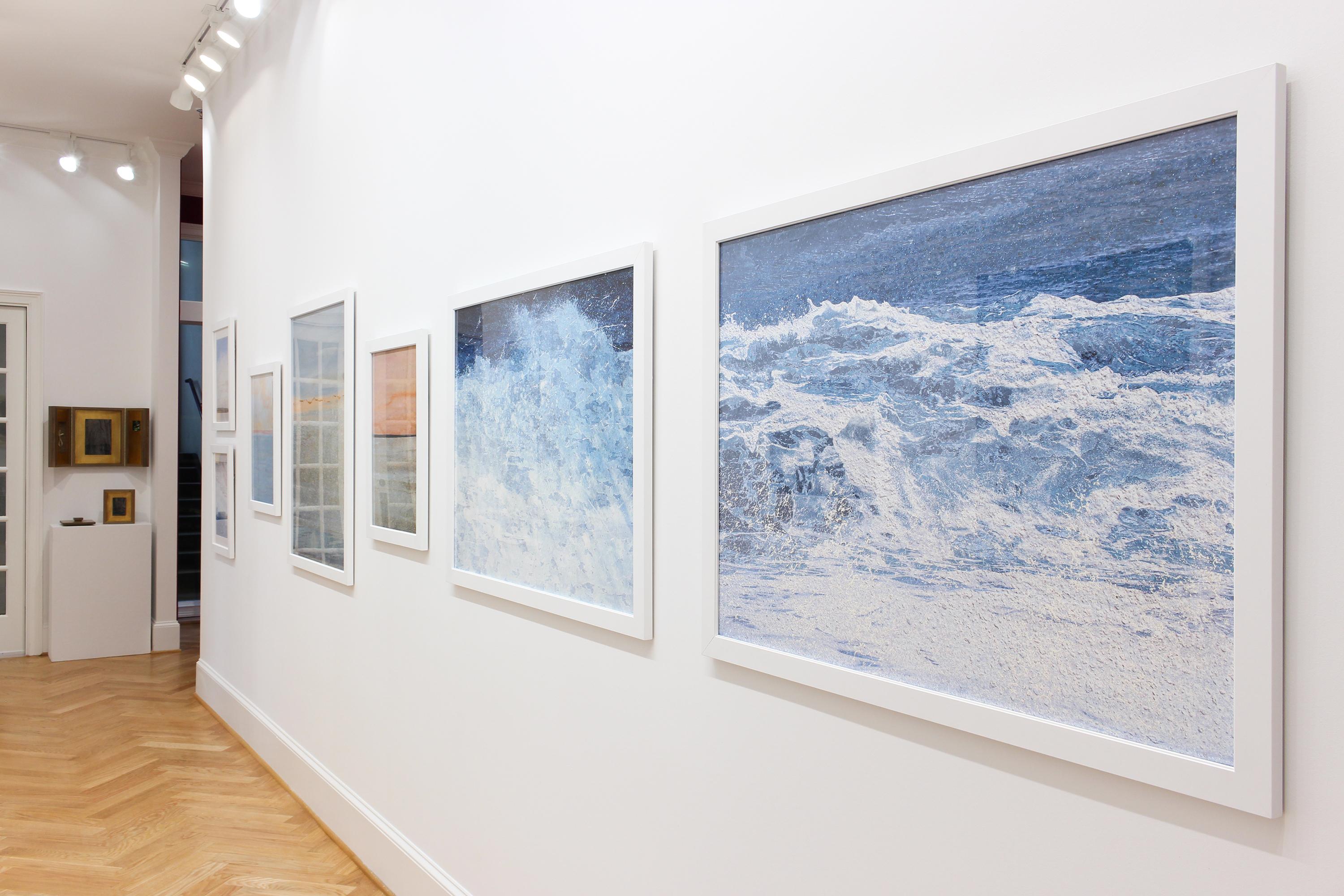 This textured composite landscape, beachscape, seascape features hues of blue and white. This listing is for an unframed print.

Jennifer McKinnon Richman is an Atlanta-based photographic artist using dumpster walls to explore the impact of human