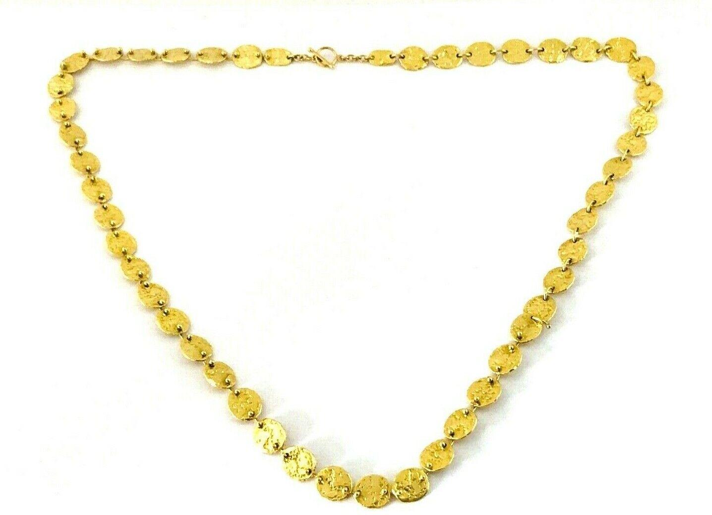 18k hammered yellow gold chain necklace by Jennifer Meyer. Consists of hammered scales connected with each other by the tiny gold wires. Features toggle clasp. Stamped with the Jennifer Meyer maker's mark and a hallmark for 18k gold.
Measurements: