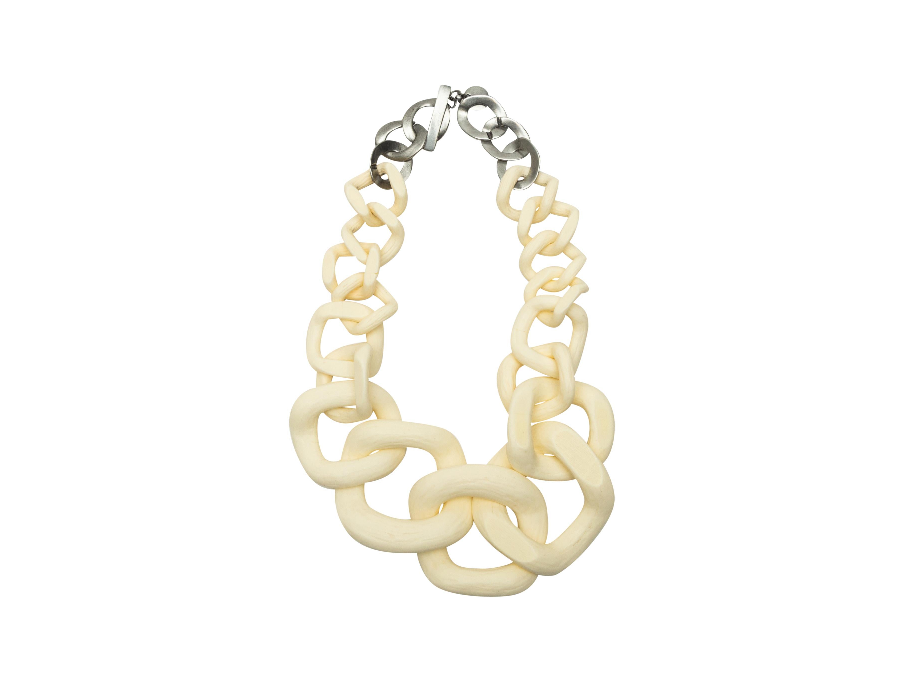 Product details: Cream and silver large link necklace by Jennifer Miller. Closure at end. 24