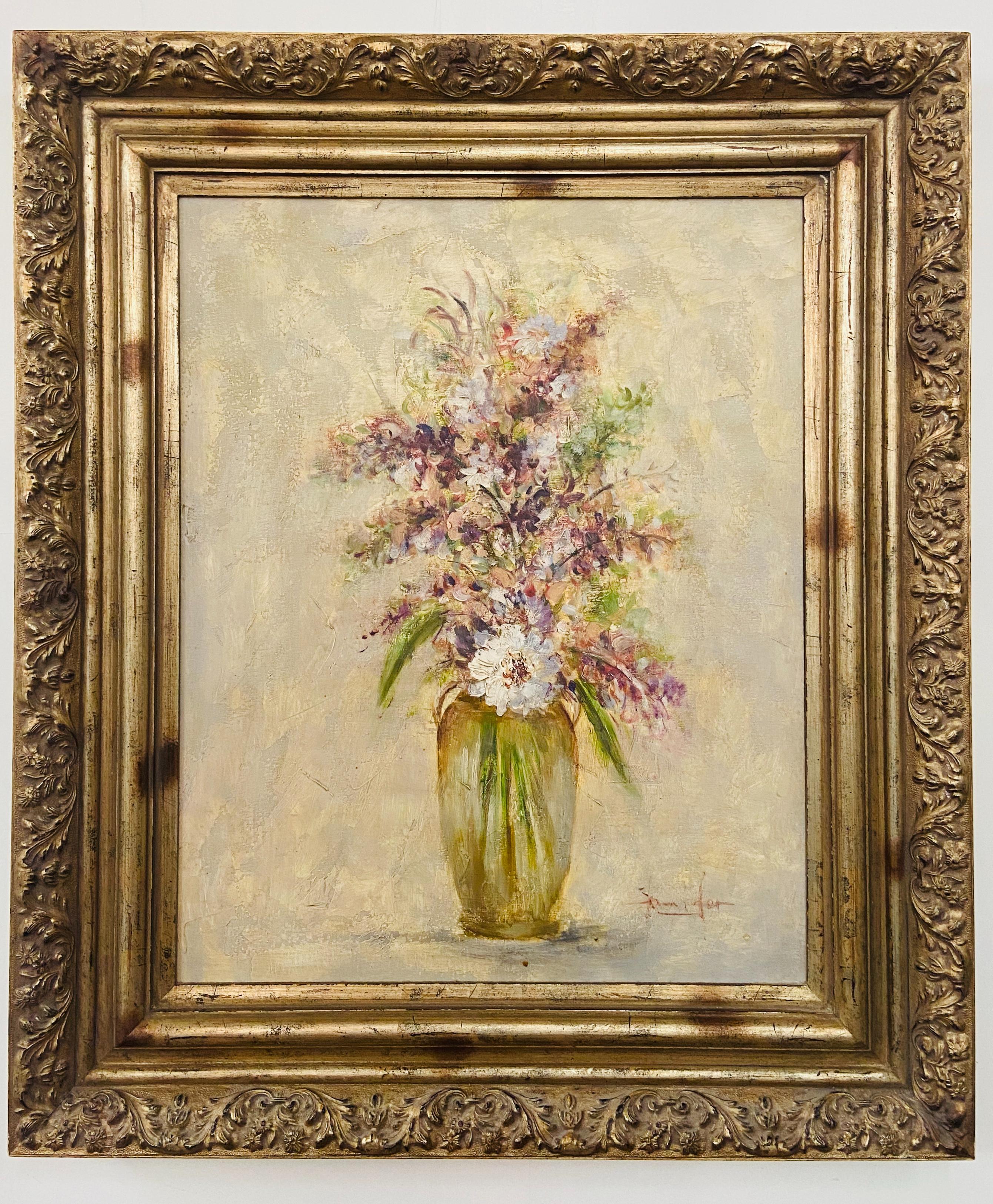 A gorgeous oil on canvas painting in a pastel tone depicting a vase with white flowers and lavenders in a vase. The painting is beautifully framed in a custom gilt carved wood frame and is signed by artist Jennifer. 

Dimensions: 40.5